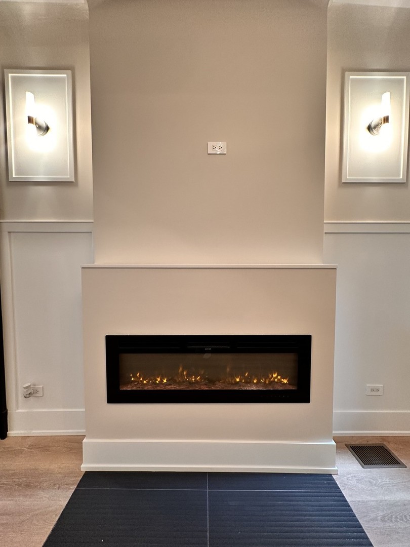4409 South Prairie Avenue Chicago, IL 60653 - Photo 16 of 44 a close view of a fireplace in wooden floor