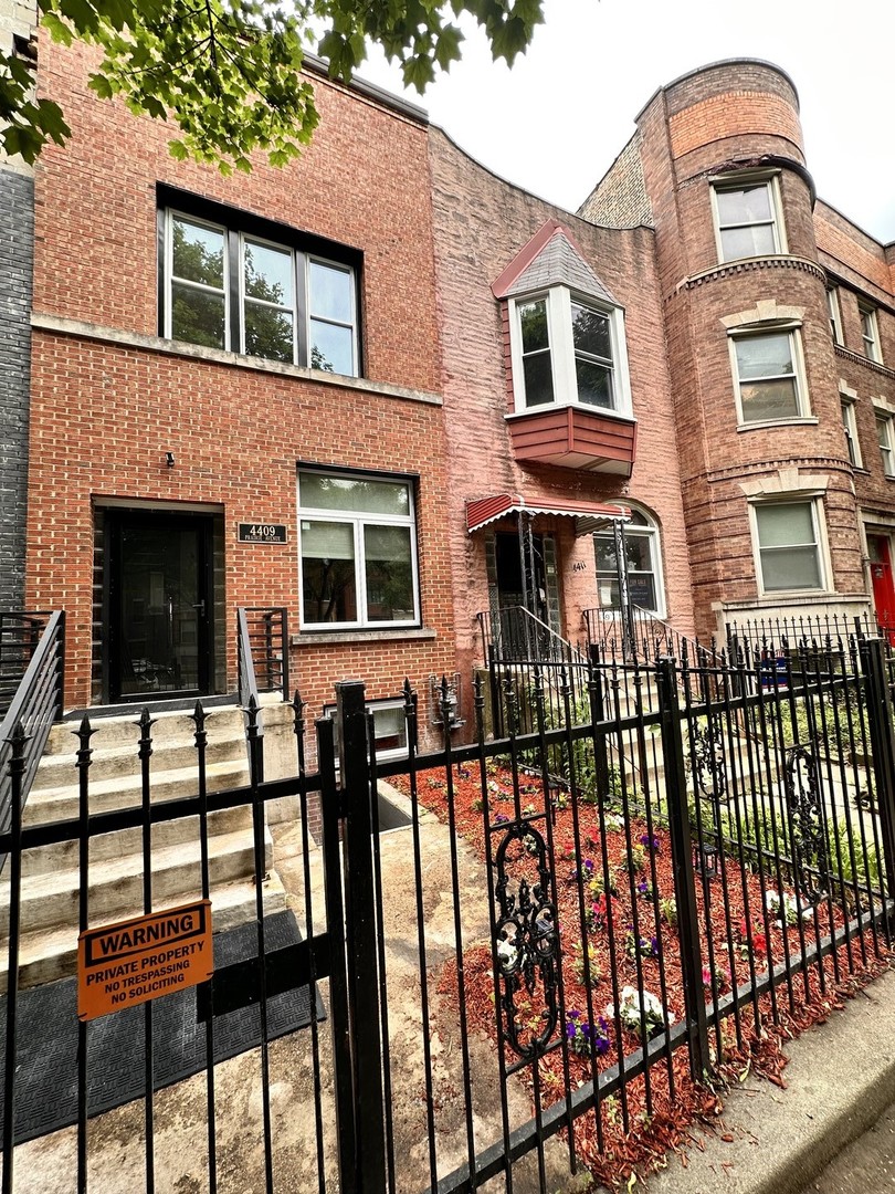 4409 South Prairie Avenue Chicago, IL 60653 - Photo 2 of 44 a front view of a house with glass windows