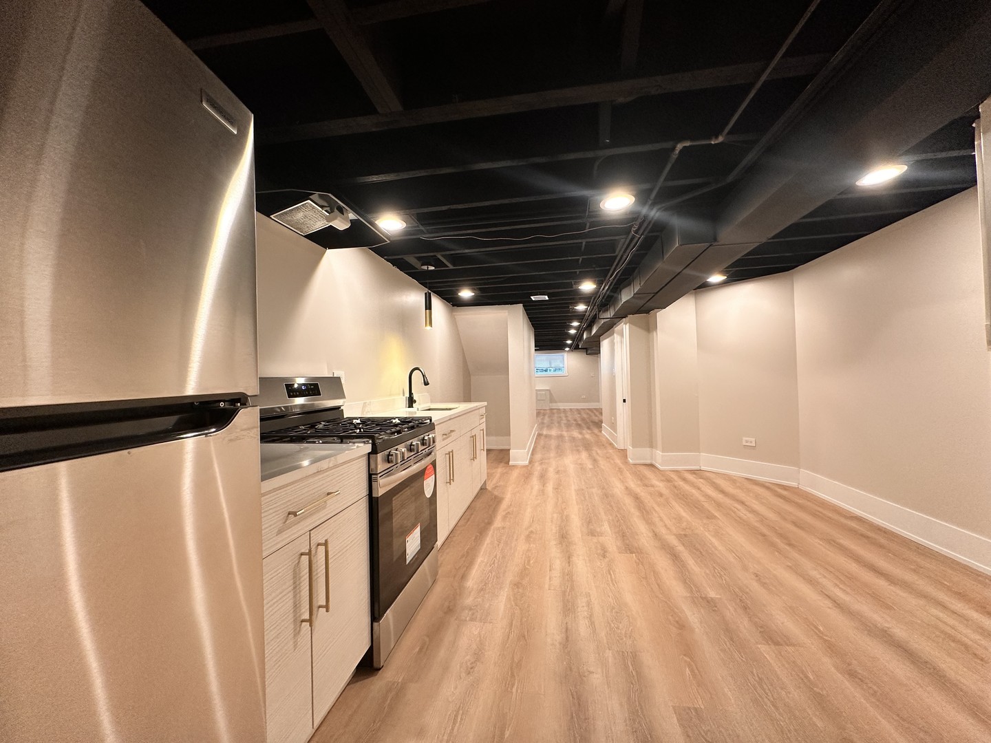 4409 South Prairie Avenue Chicago, IL 60653 - Photo 35 of 44 a view of an empty room with wooden floor