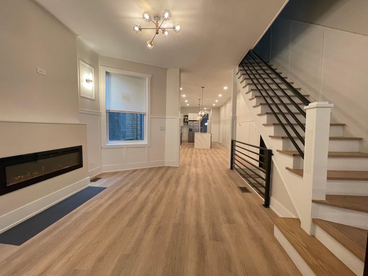 4409 South Prairie Avenue Chicago, IL 60653 - Photo 8 of 44 wooden floor in an empty room with a fireplace