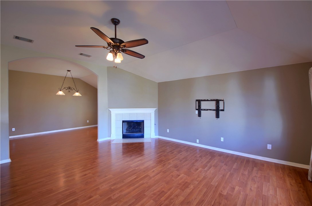 129 Copperwood Loop Round Rock, TX 78665 - Photo 12 of 30 a view of a livingroom with a ceiling fan and wooden floor