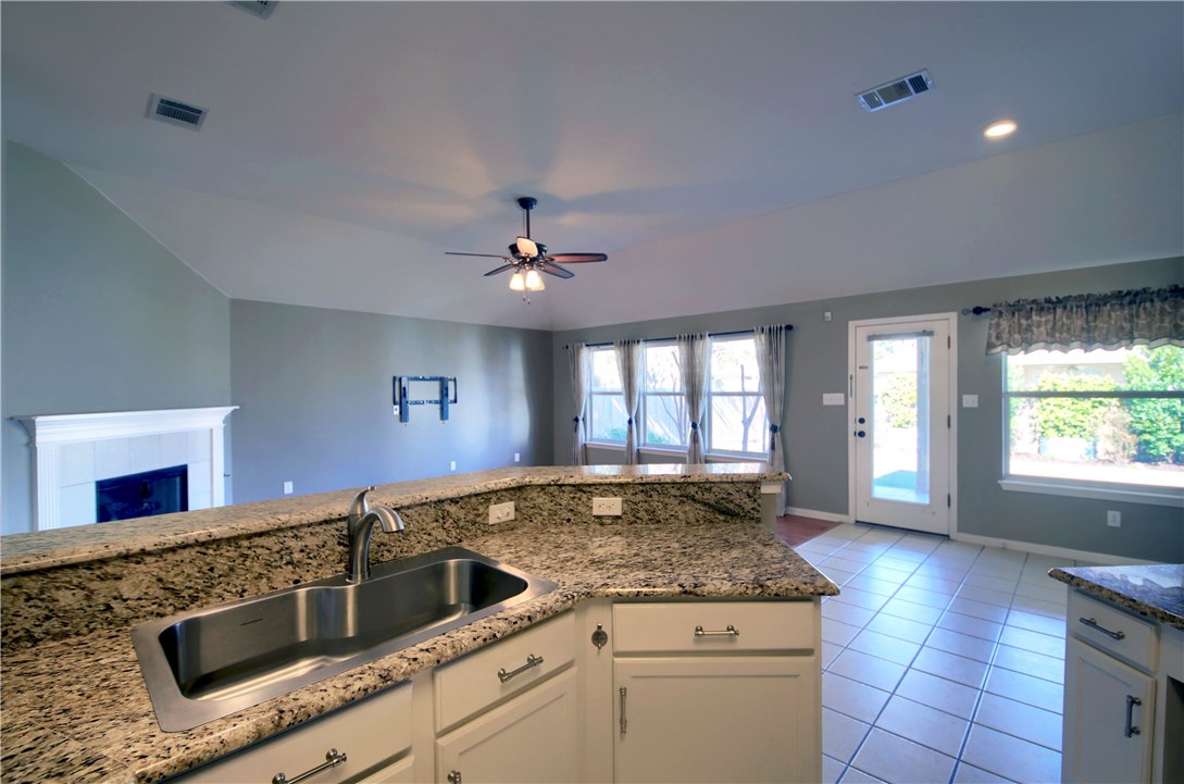 129 Copperwood Loop Round Rock, TX 78665 - Photo 15 of 30 a kitchen with a stove and a sink