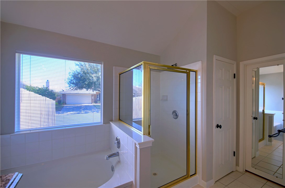 129 Copperwood Loop Round Rock, TX 78665 - Photo 25 of 30 a bathroom with a bathtub and a shower