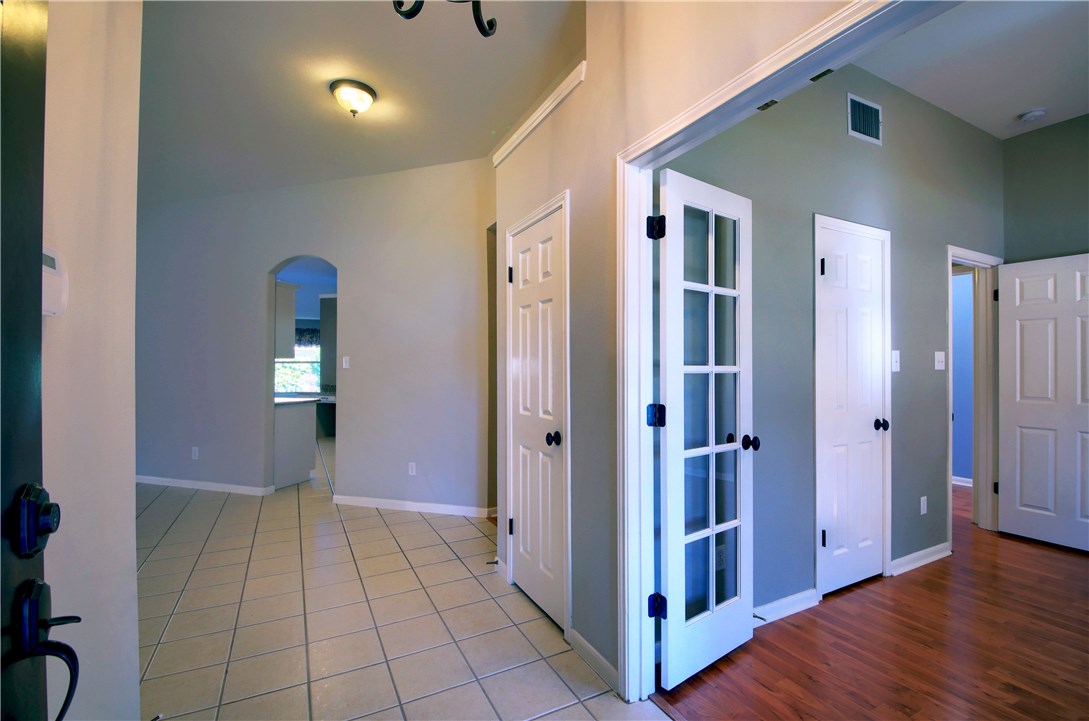 129 Copperwood Loop Round Rock, TX 78665 - Photo 4 of 30 a view of a hallway with wooden floor and closet area