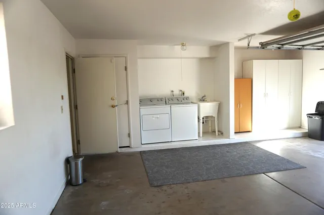 a work room with furniture and rug floor