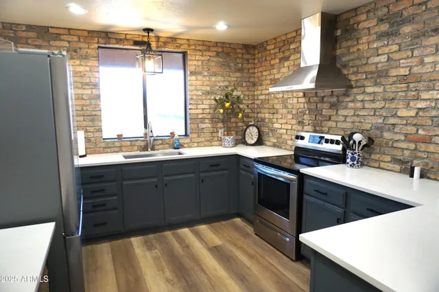 a room with pool table and windows