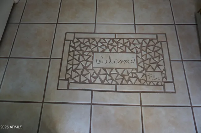 an empty room with wooden floor a ceiling fan and windows