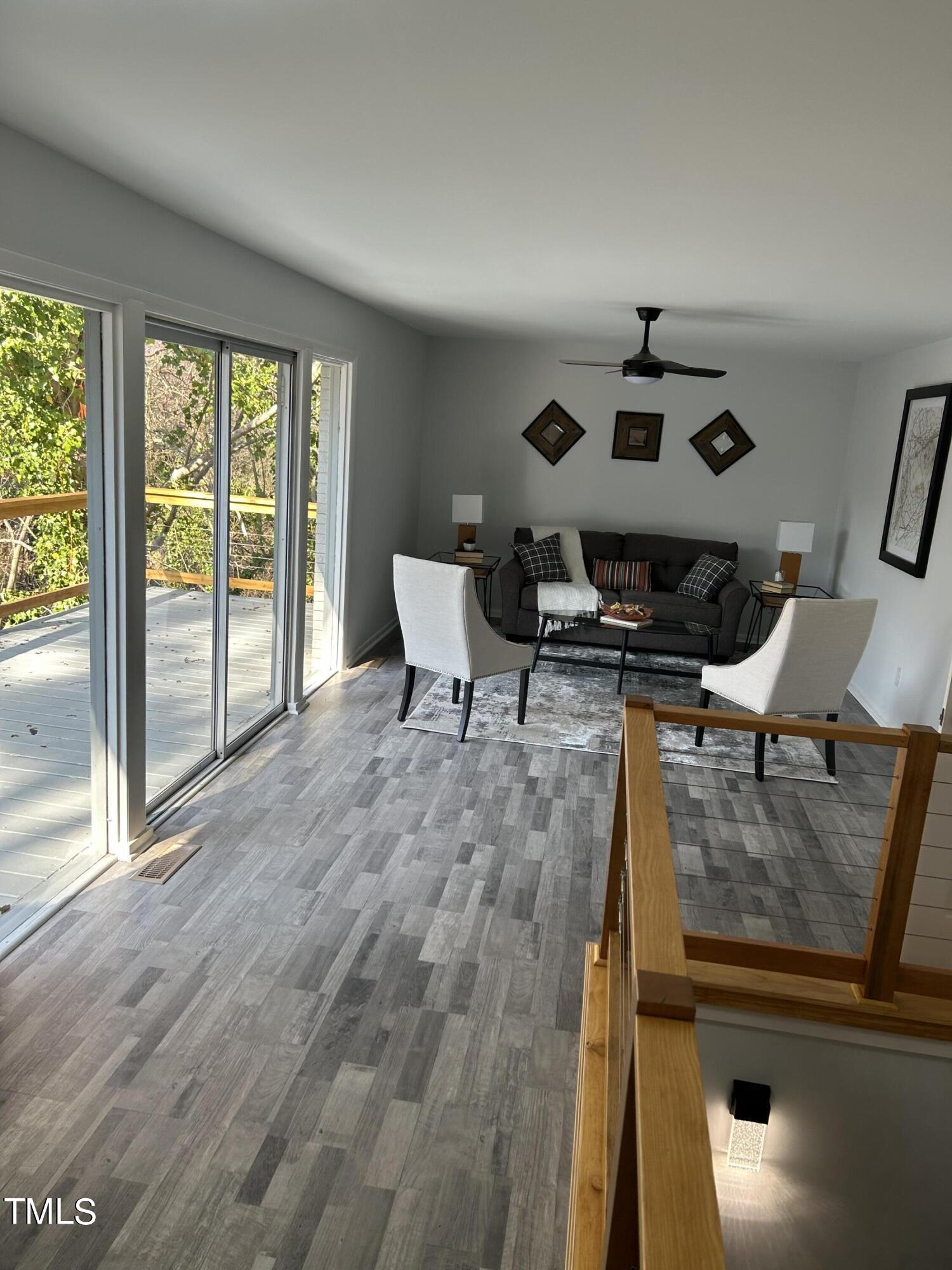 2208 Sanderford Road Raleigh, NC 27610 - Photo 19 of 75 Living room with walk out to deck.