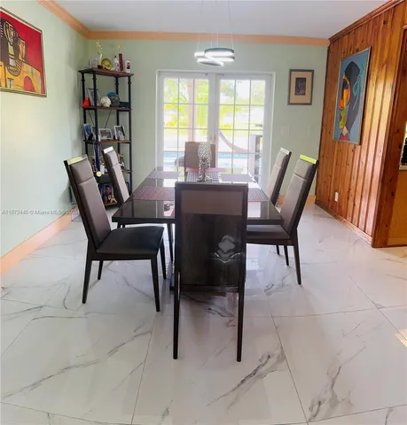 a view of a dining room with furniture window and outside view