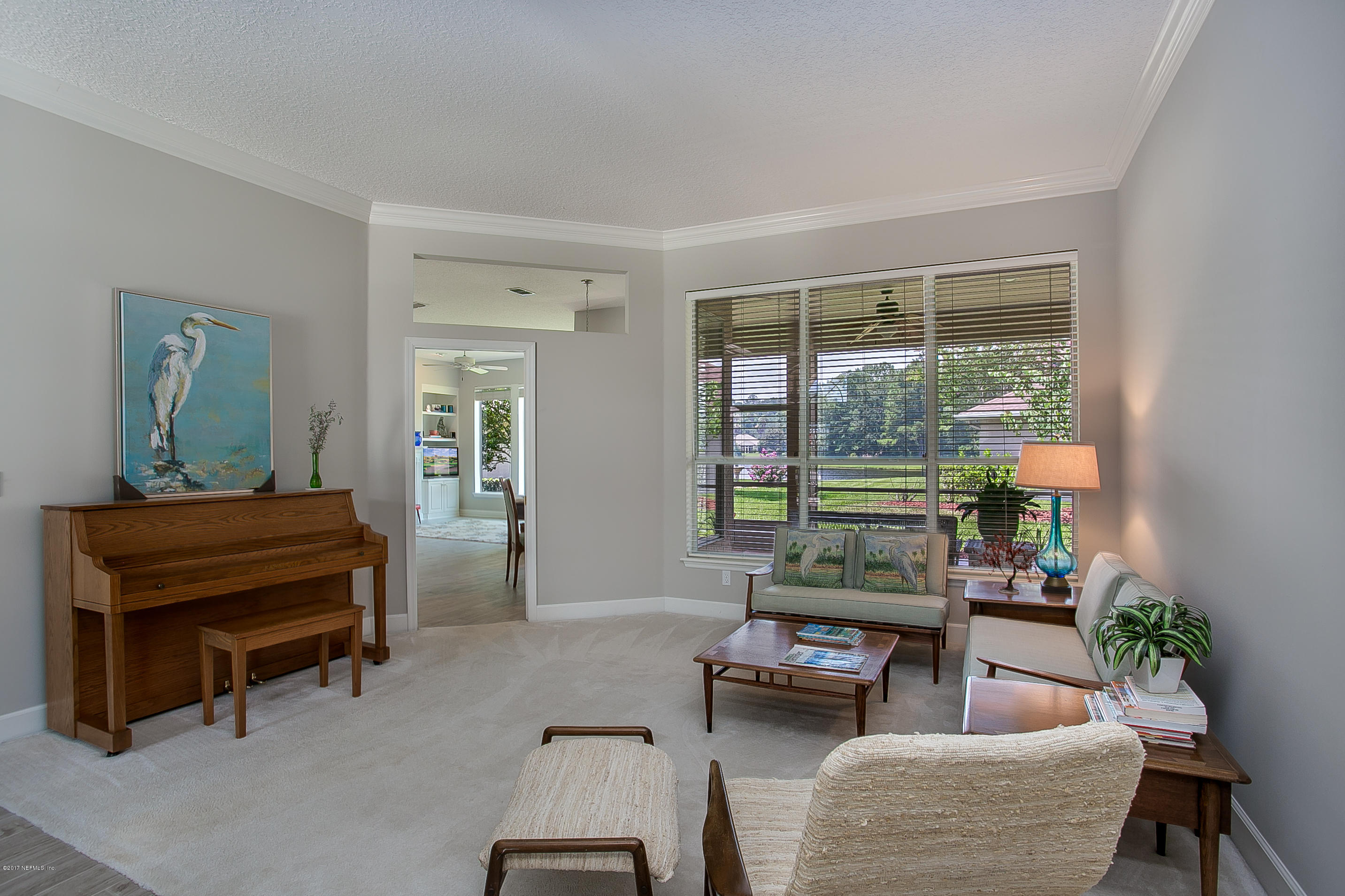 261 North Mill View Way Ponte Vedra Beach, FL 32082 - Photo 11 of 27 a living room with furniture and a window
