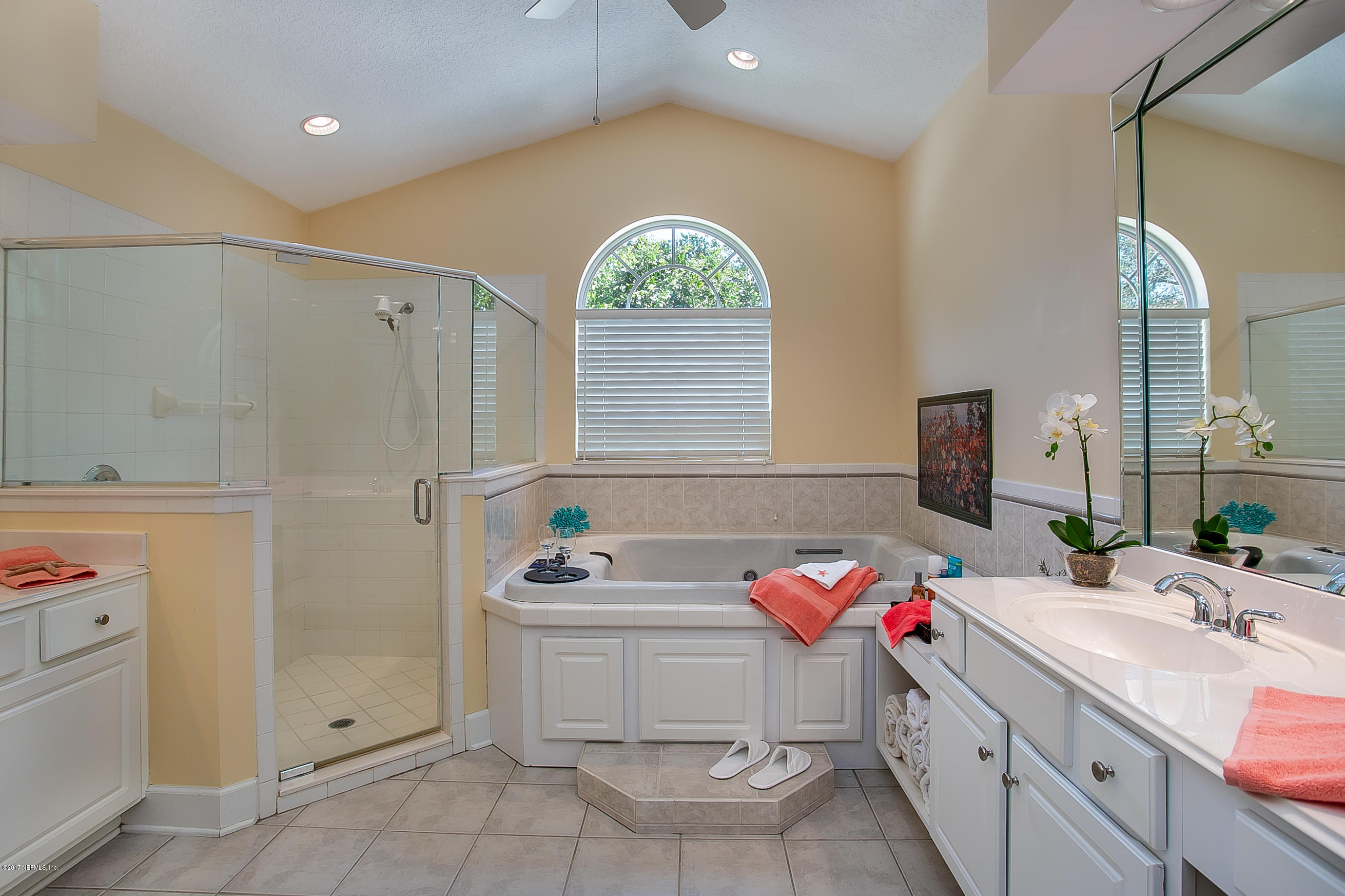 261 North Mill View Way Ponte Vedra Beach, FL 32082 - Photo 14 of 27 a bathroom with a sink mirror and window