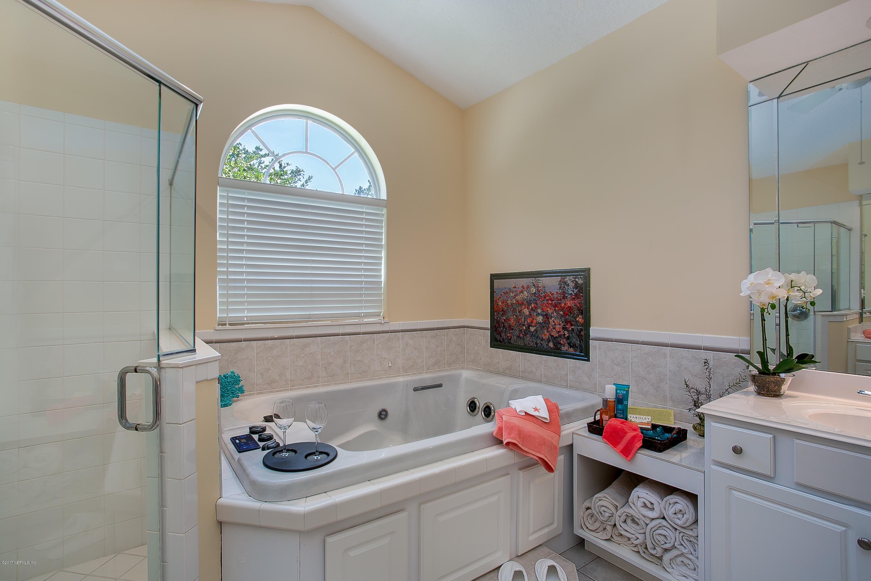 261 North Mill View Way Ponte Vedra Beach, FL 32082 - Photo 15 of 27 a bathroom with a bath tub a sink and a window