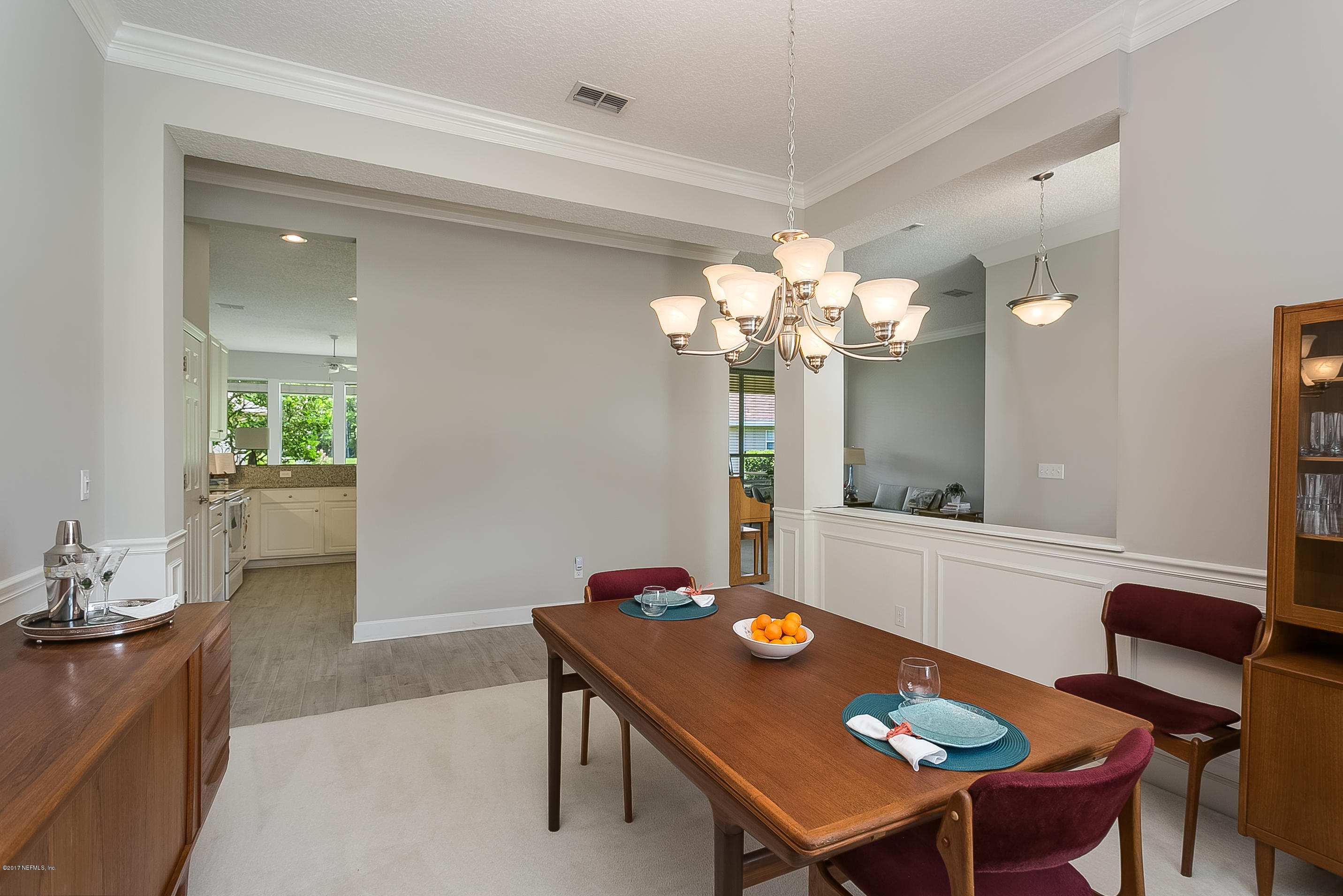 261 North Mill View Way Ponte Vedra Beach, FL 32082 - Photo 17 of 27 a view of a dining room with furniture and chandelier