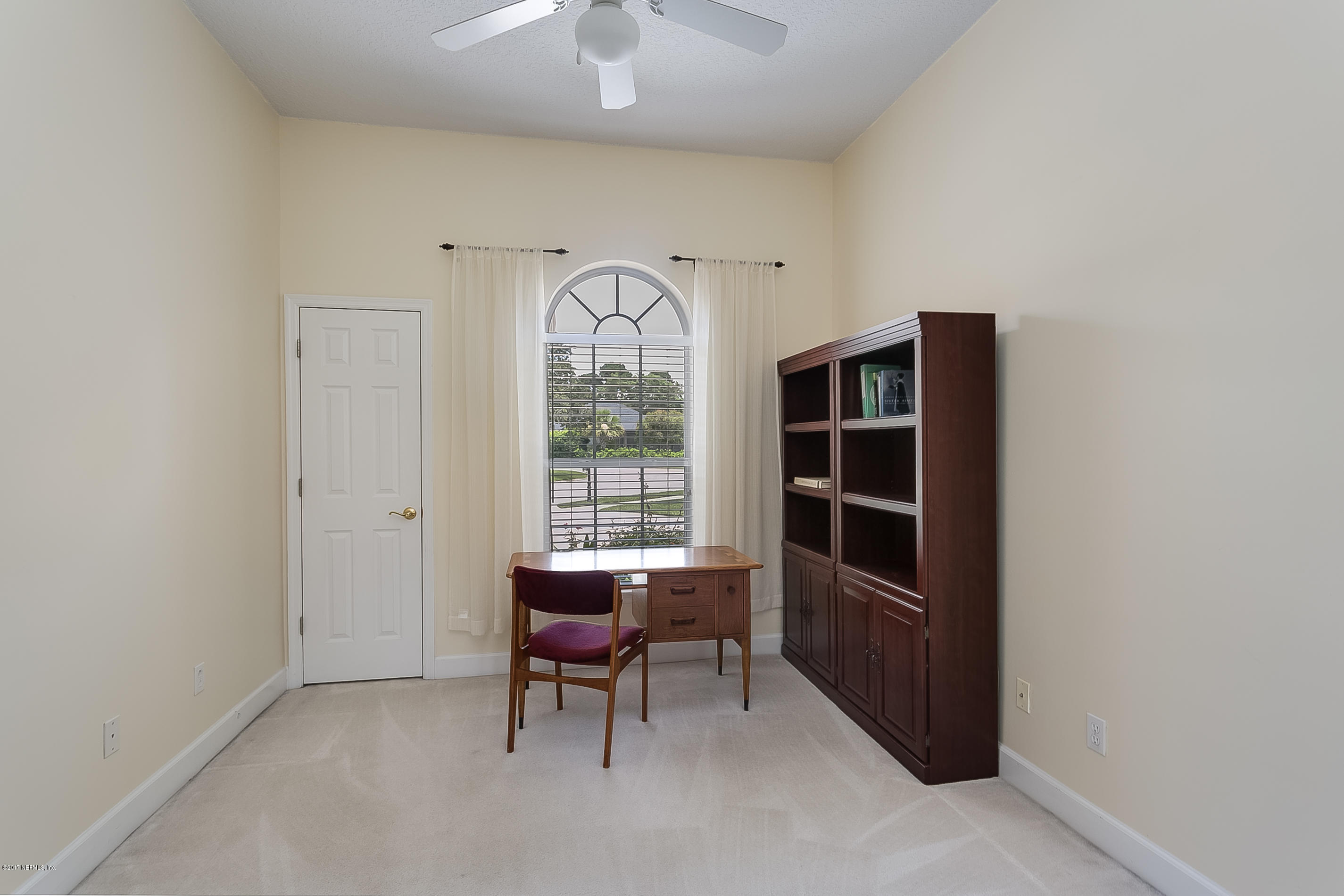 261 North Mill View Way Ponte Vedra Beach, FL 32082 - Photo 18 of 27 a view of room with windows and wooden walls