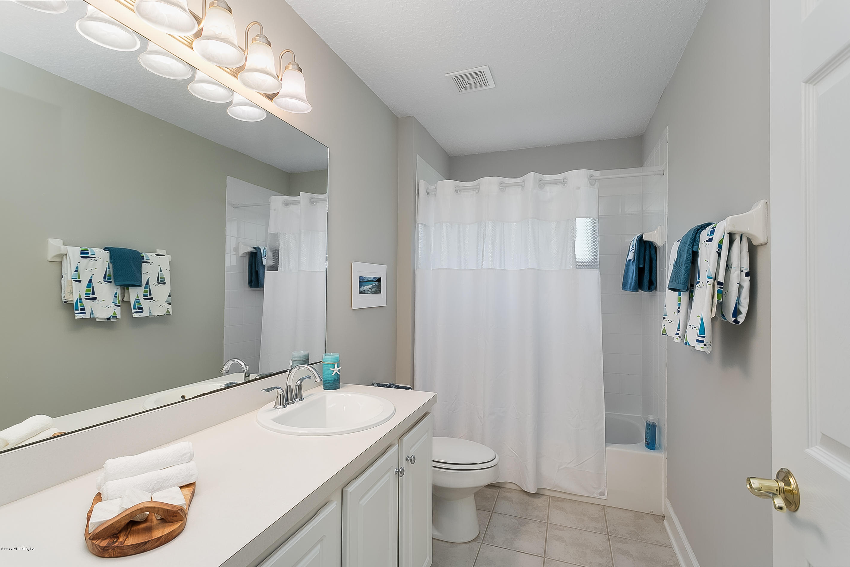 261 North Mill View Way Ponte Vedra Beach, FL 32082 - Photo 21 of 27 a bathroom with a sink vanity granite and toilet