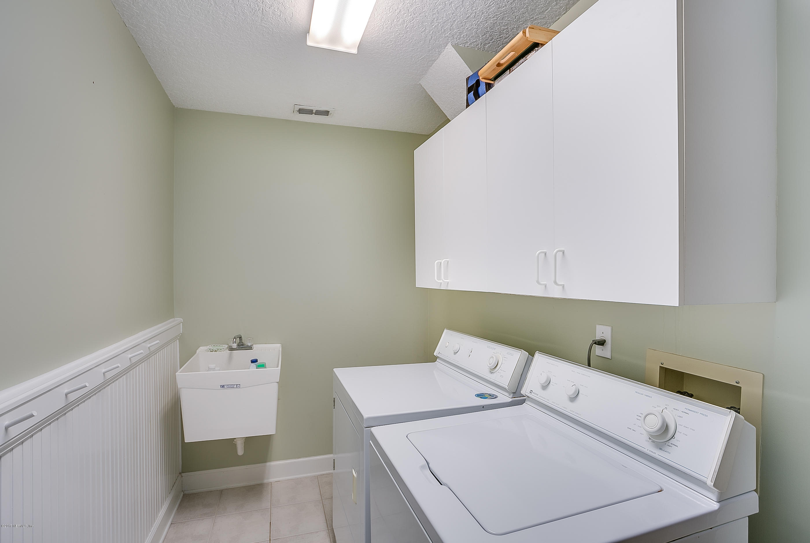 261 North Mill View Way Ponte Vedra Beach, FL 32082 - Photo 22 of 27 a utility room with dryer and washer