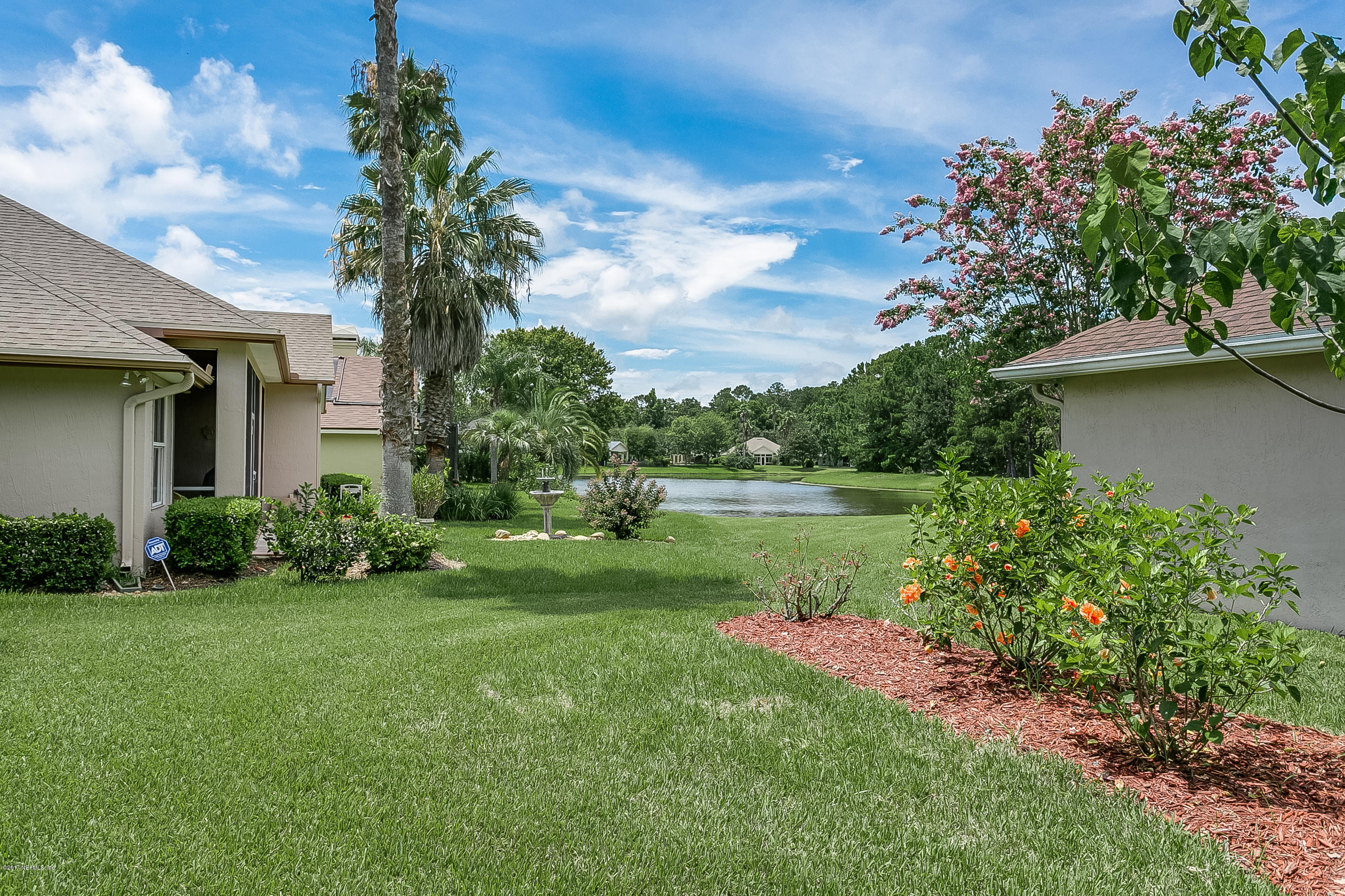 261 North Mill View Way Ponte Vedra Beach, FL 32082 - Photo 23 of 27 a front view of a house with garden