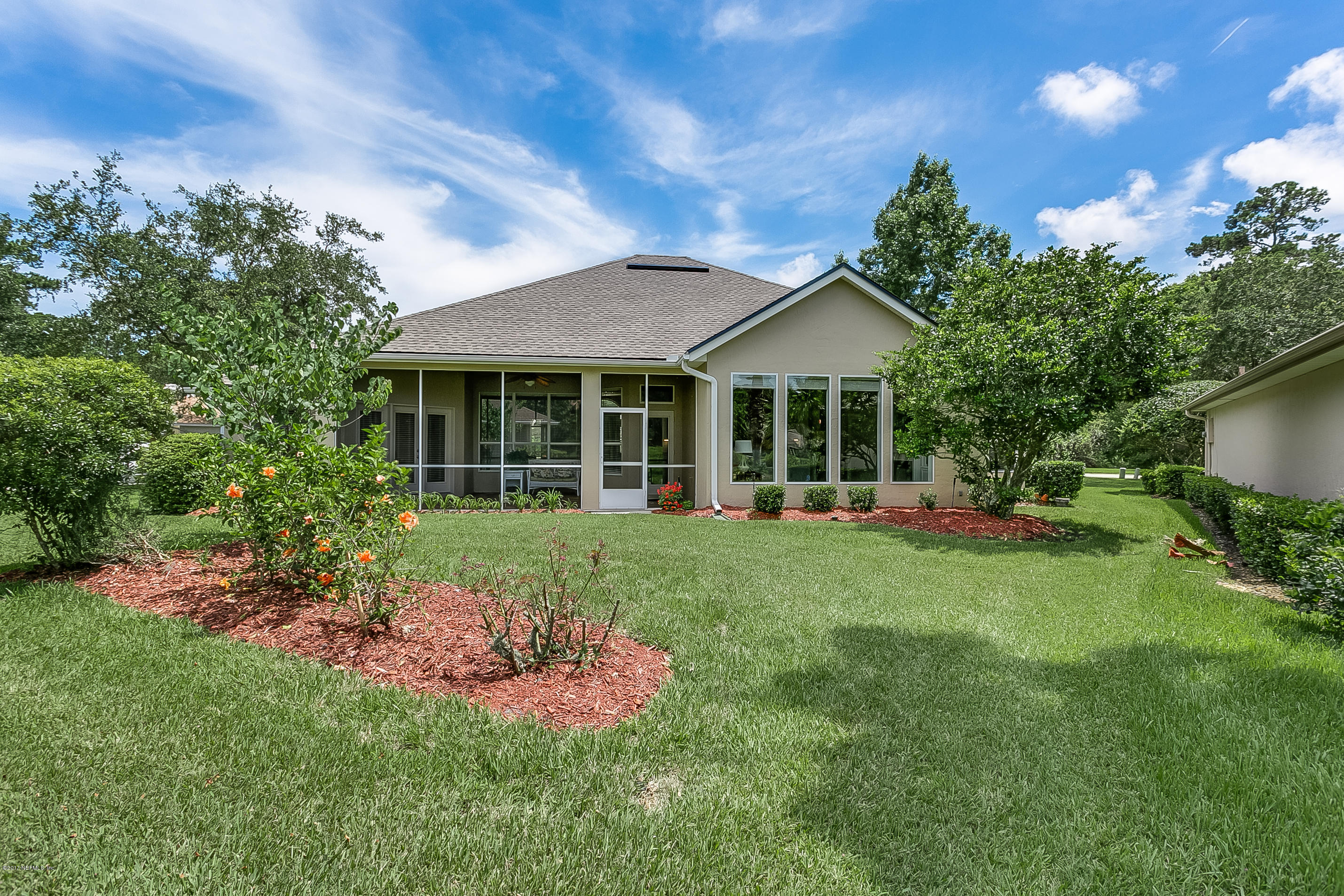 261 North Mill View Way Ponte Vedra Beach, FL 32082 - Photo 24 of 27 a front view of a house with a yard and porch