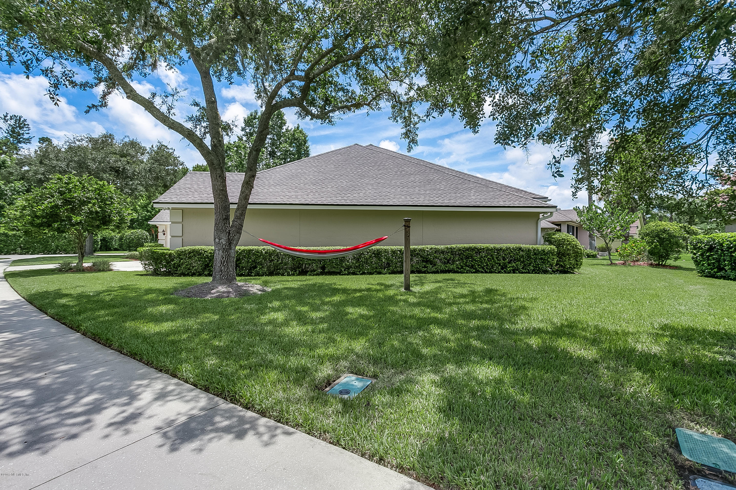 261 North Mill View Way Ponte Vedra Beach, FL 32082 - Photo 25 of 27 a front view of a house with garden