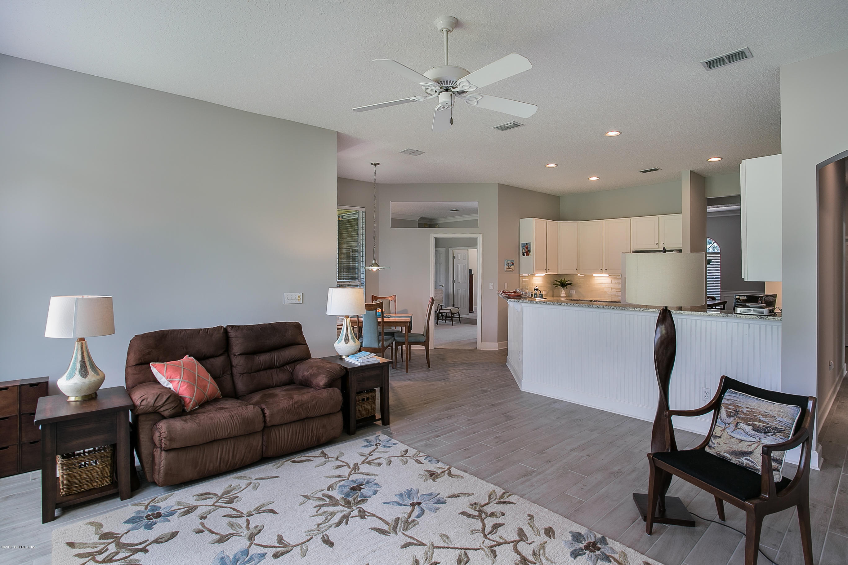 261 North Mill View Way Ponte Vedra Beach, FL 32082 - Photo 8 of 27 a living room with furniture and kitchen view