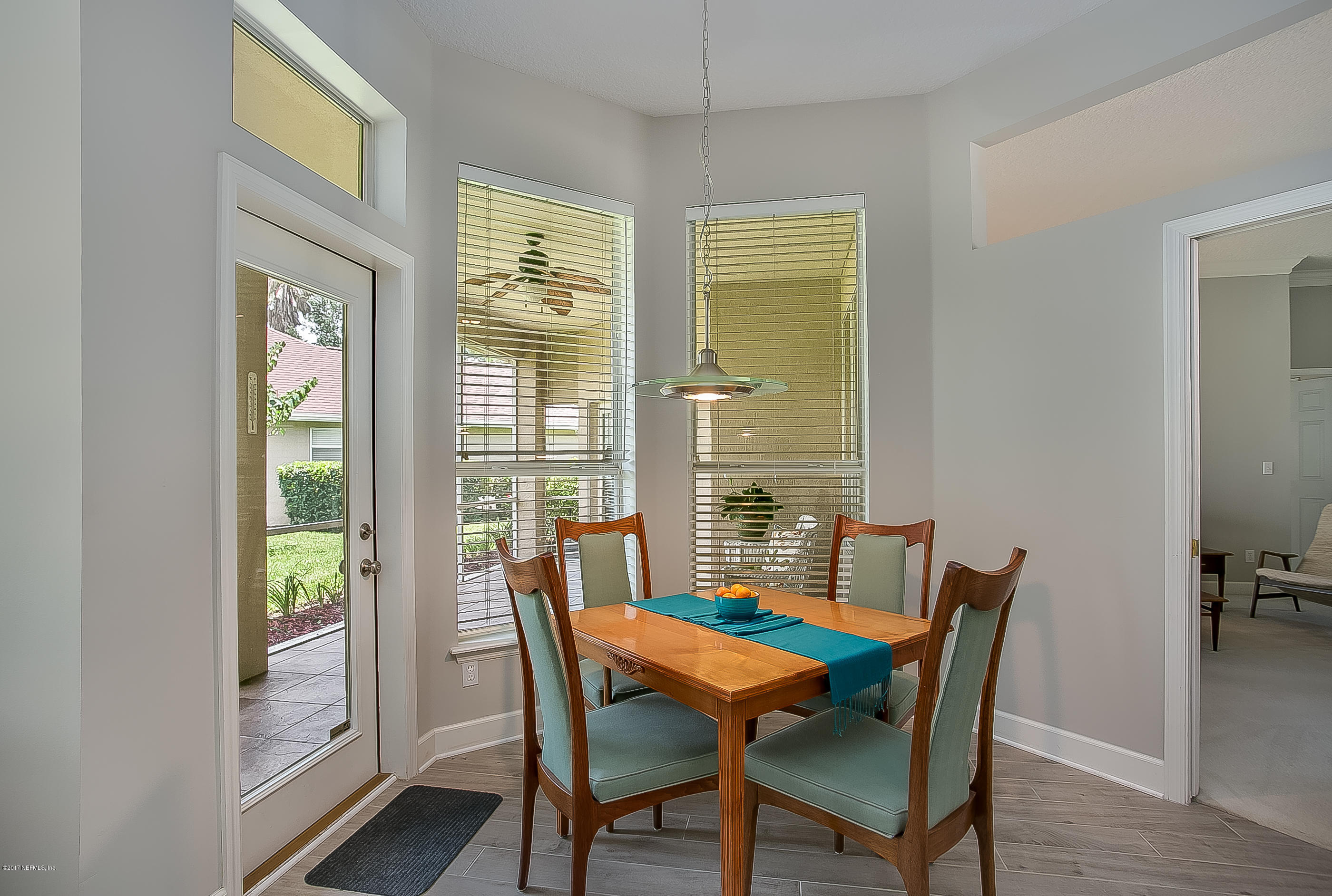 261 North Mill View Way Ponte Vedra Beach, FL 32082 - Photo 9 of 27 a view of a dining room with furniture window and wooden floor