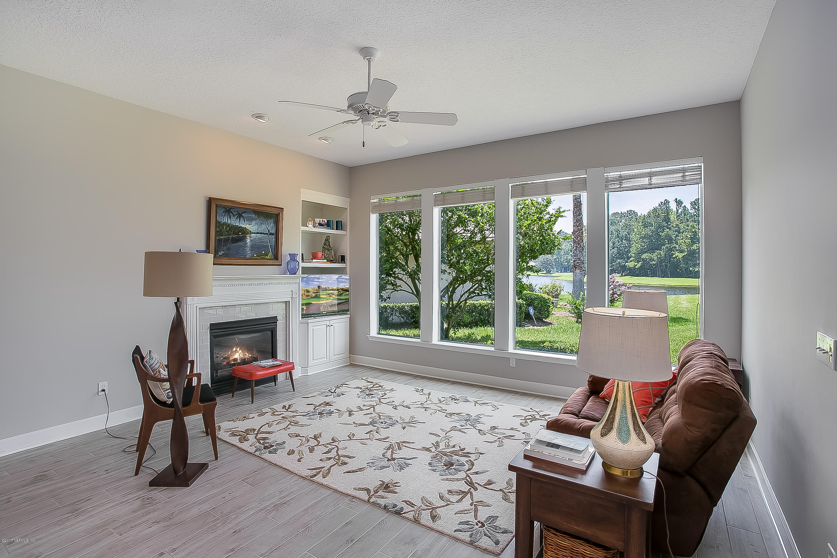 261 North Mill View Way Ponte Vedra Beach, FL 32082 - Photo 10 of 27 a living room with furniture and a fireplace
