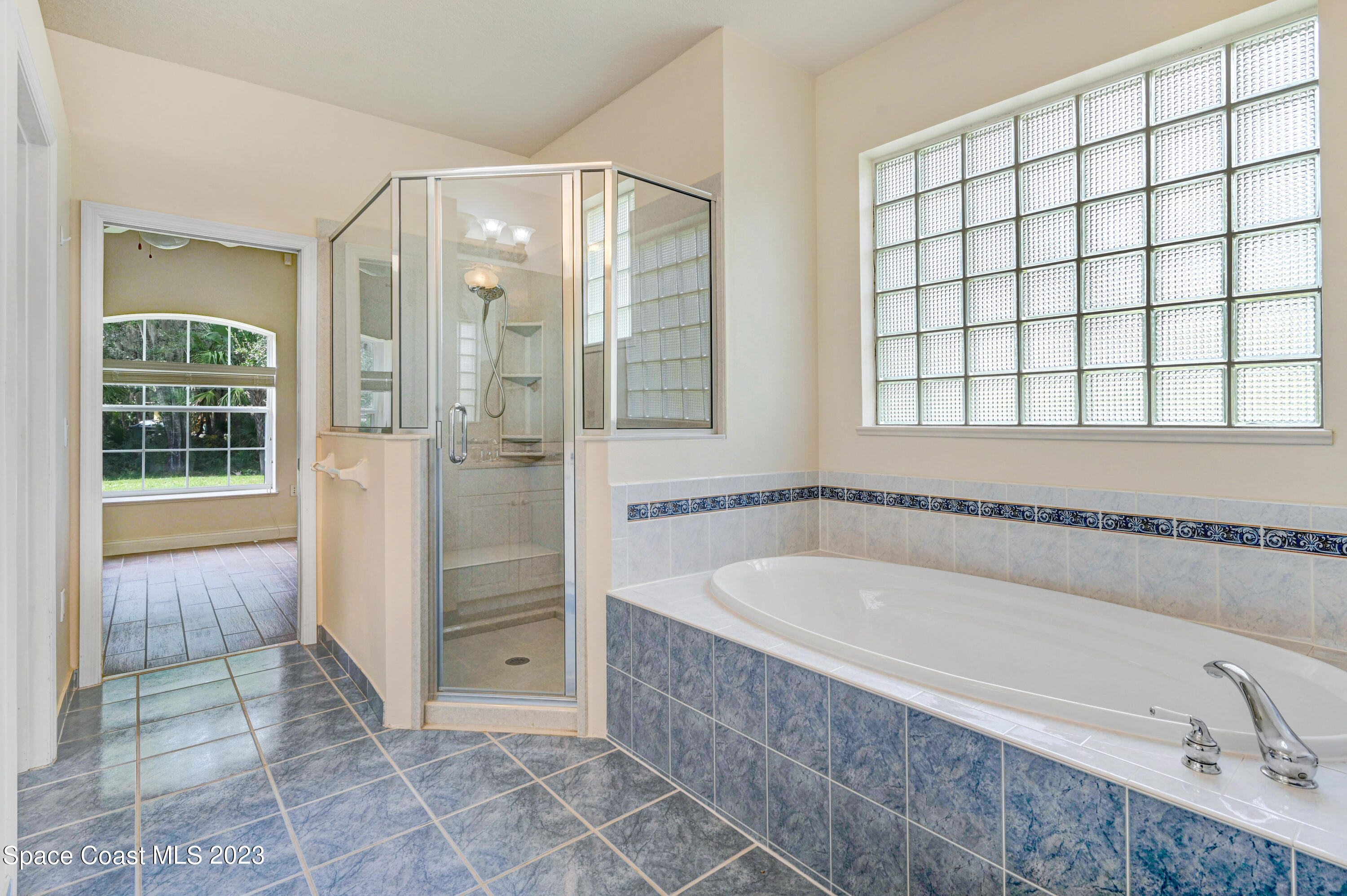 1074 Gray Road Cocoa, FL 32926 - Photo 27 of 47 a bathroom with a tub shower and sink