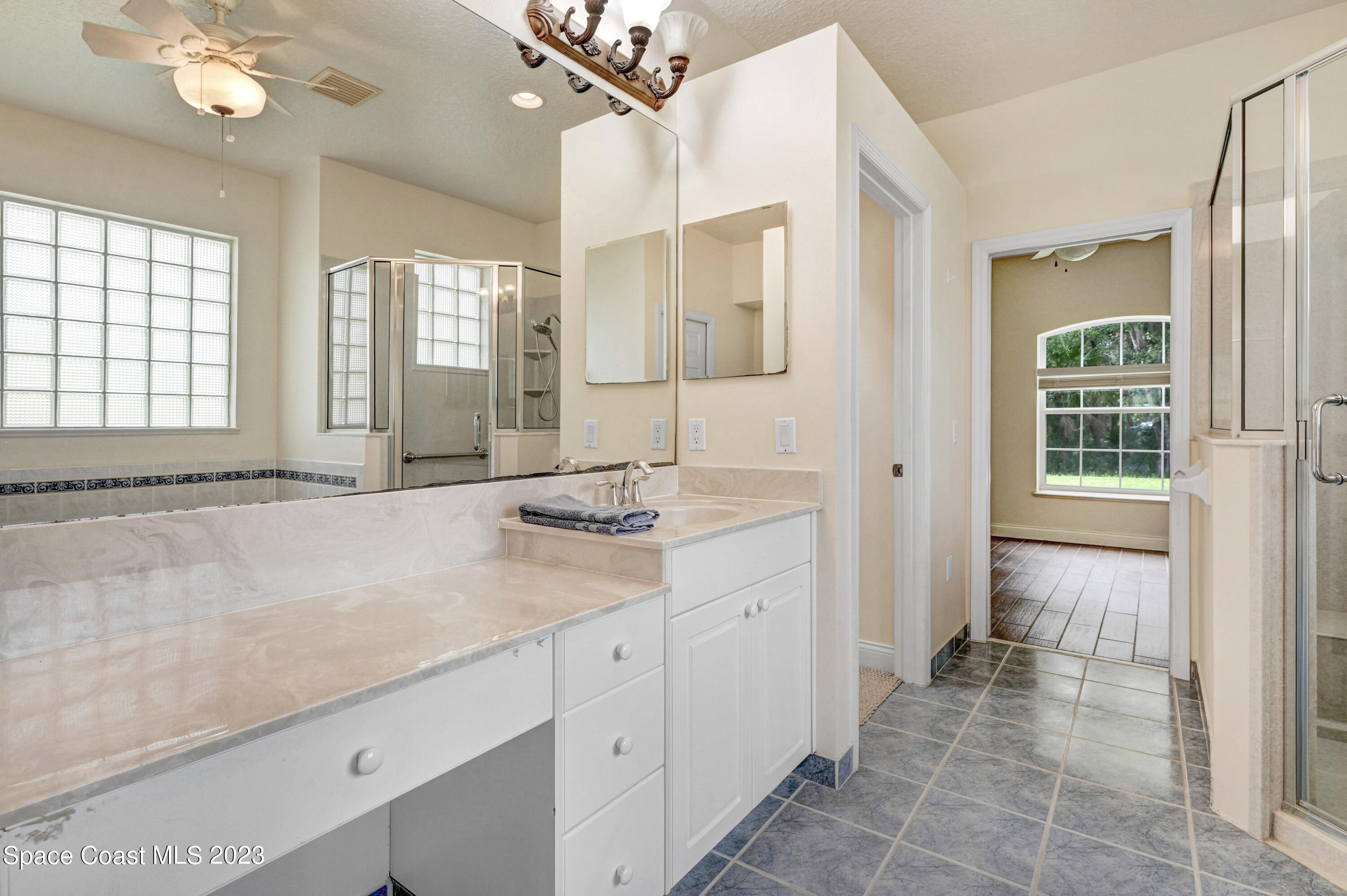 1074 Gray Road Cocoa, FL 32926 - Photo 28 of 47 a bathroom with a sink double vanity and a mirror