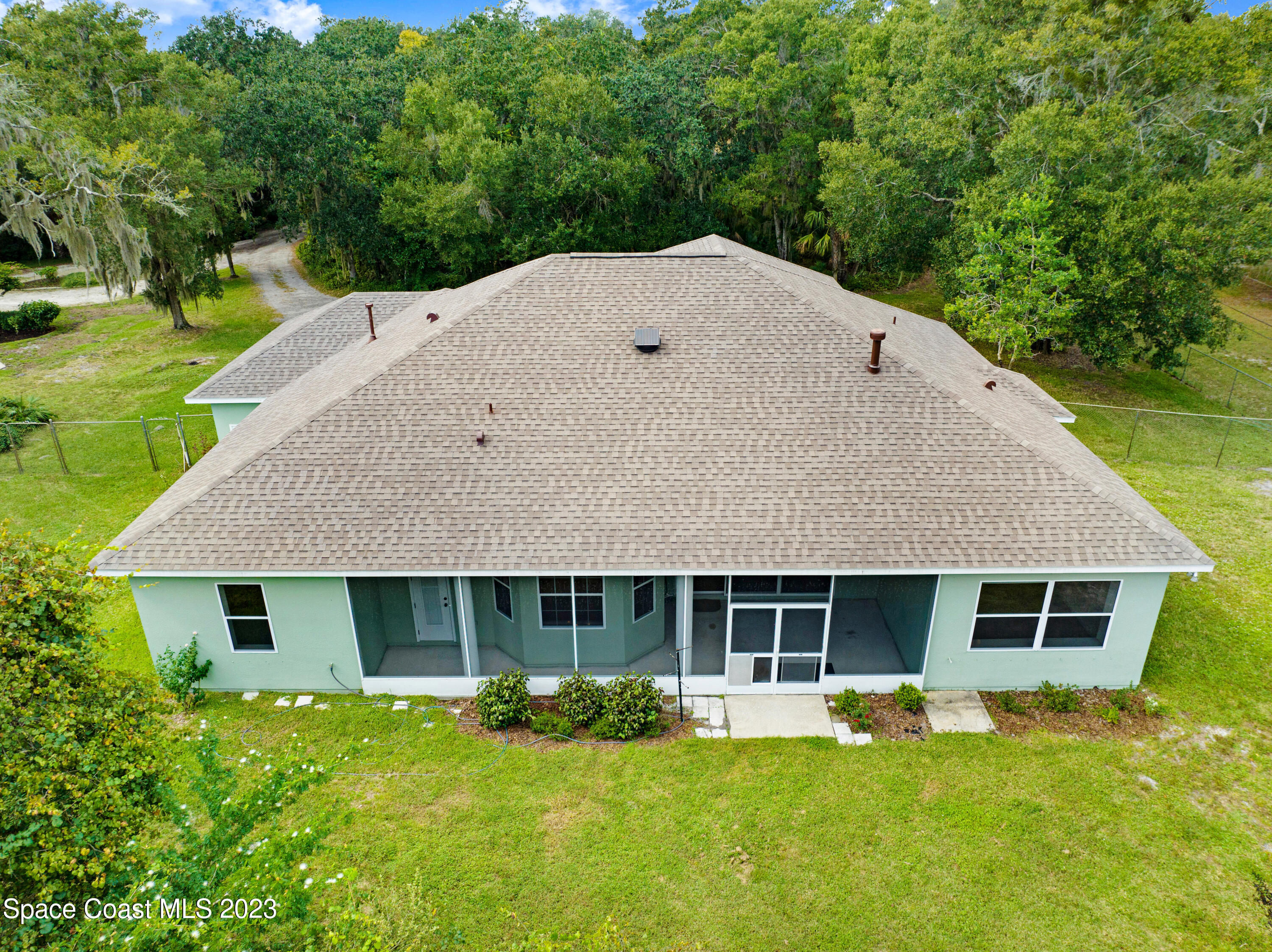 1074 Gray Road Cocoa, FL 32926 - Photo 33 of 47 a aerial view of a house with garden