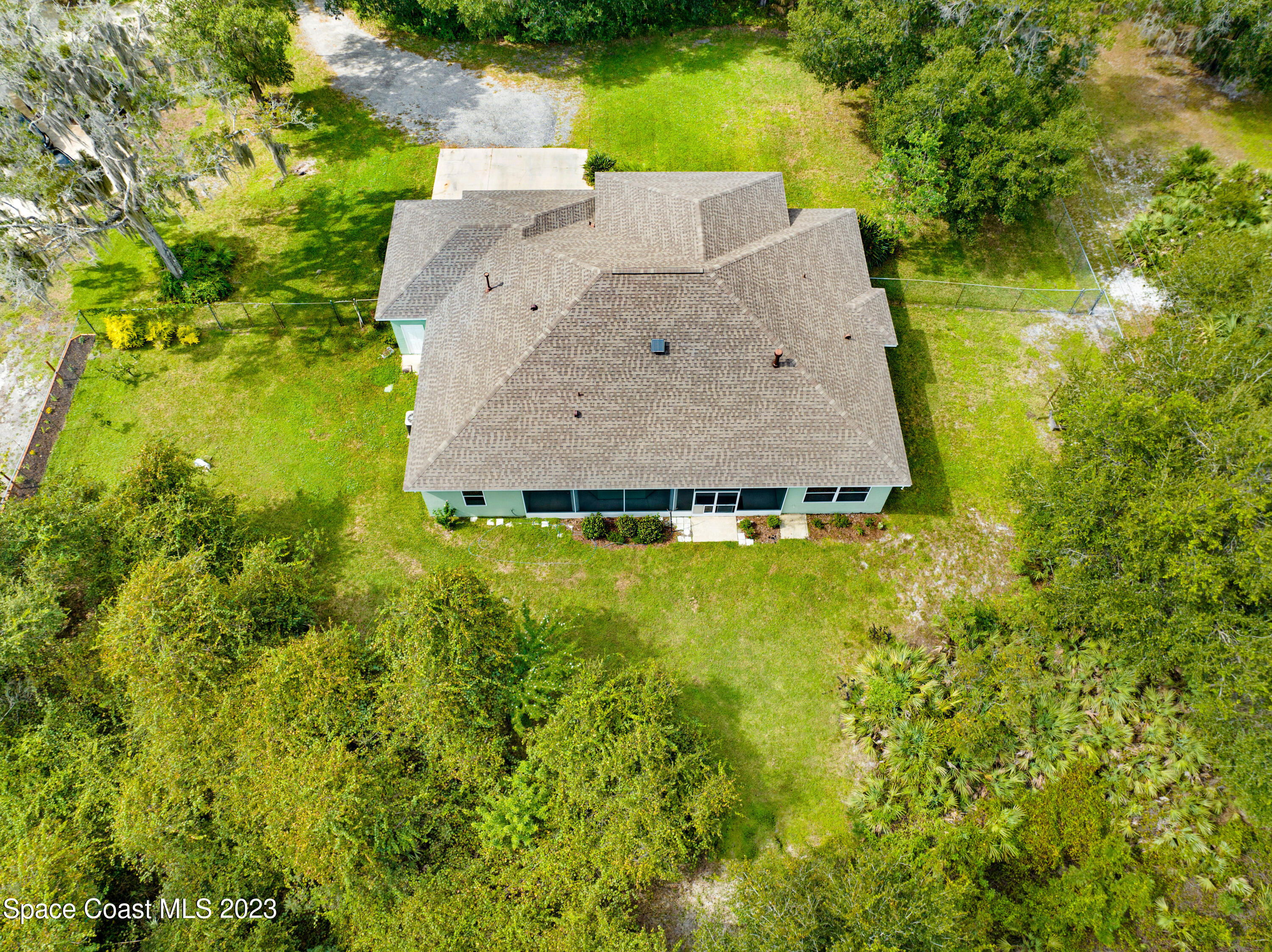1074 Gray Road Cocoa, FL 32926 - Photo 35 of 47 an aerial view of a house with pool