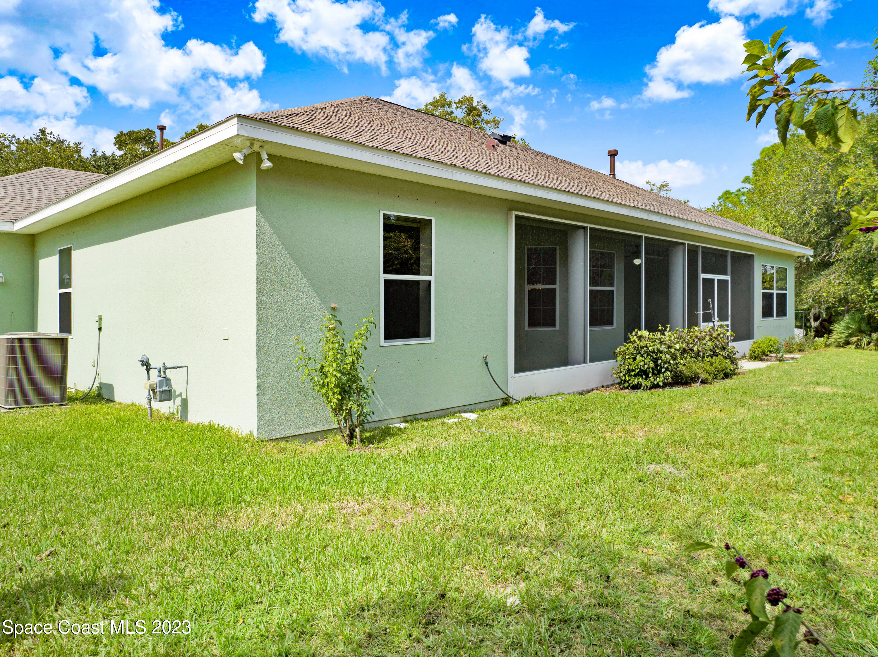 1074 Gray Road Cocoa, FL 32926 - Photo 39 of 47 a front view of a house with a yard
