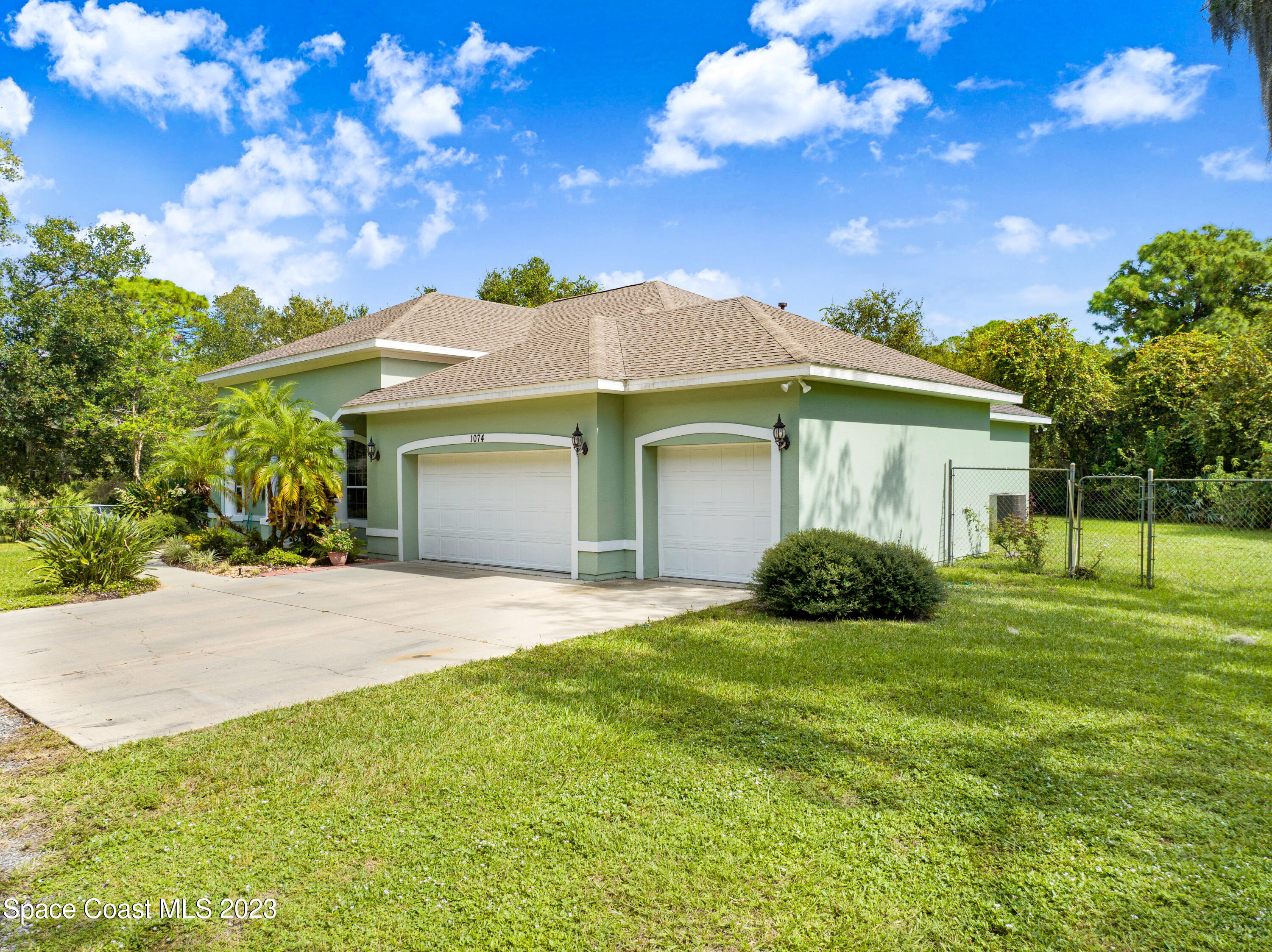 1074 Gray Road Cocoa, FL 32926 - Photo 40 of 47 a front view of a house with garden