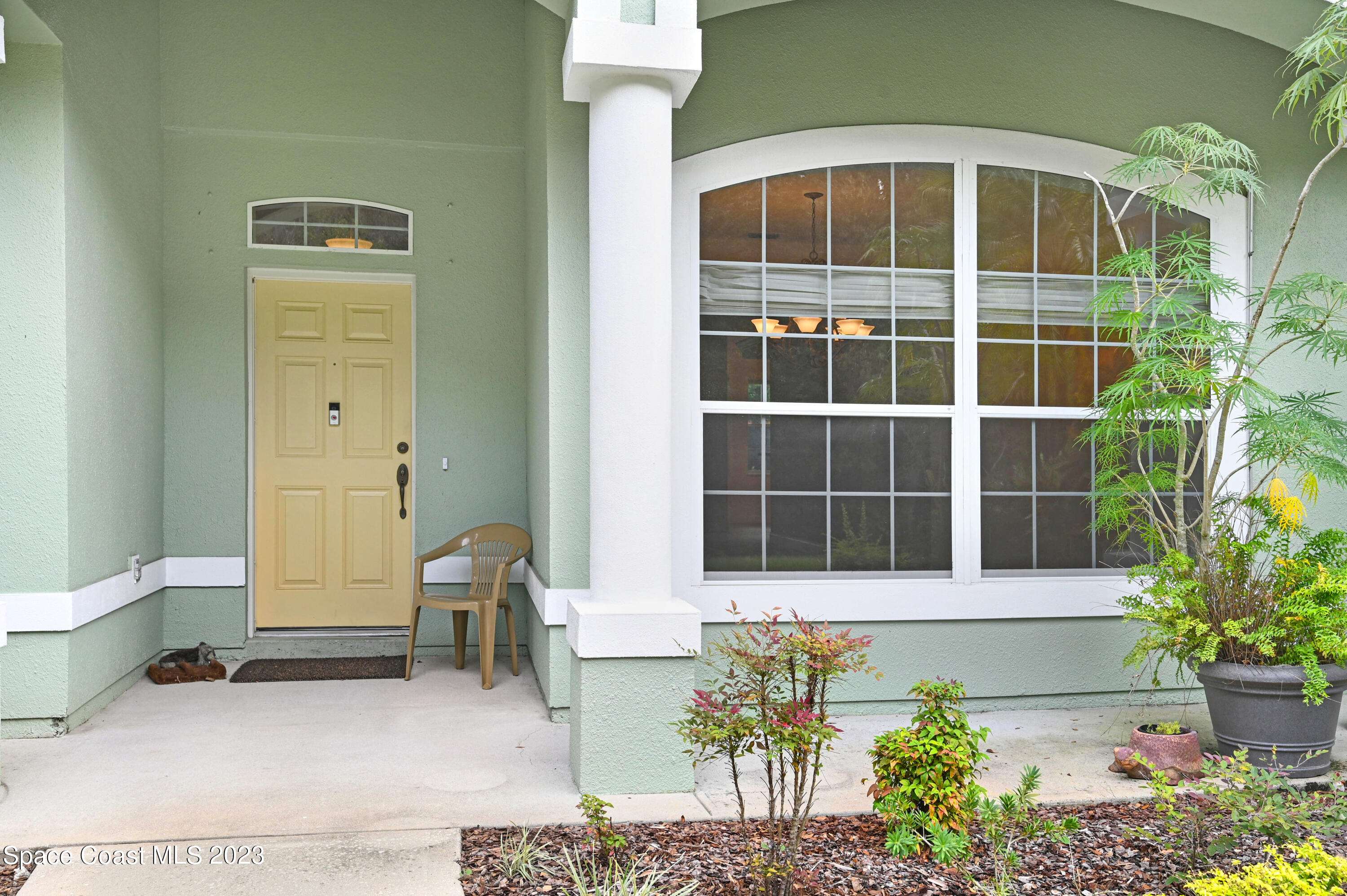 1074 Gray Road Cocoa, FL 32926 - Photo 4 of 47 a front view of a house with a yard
