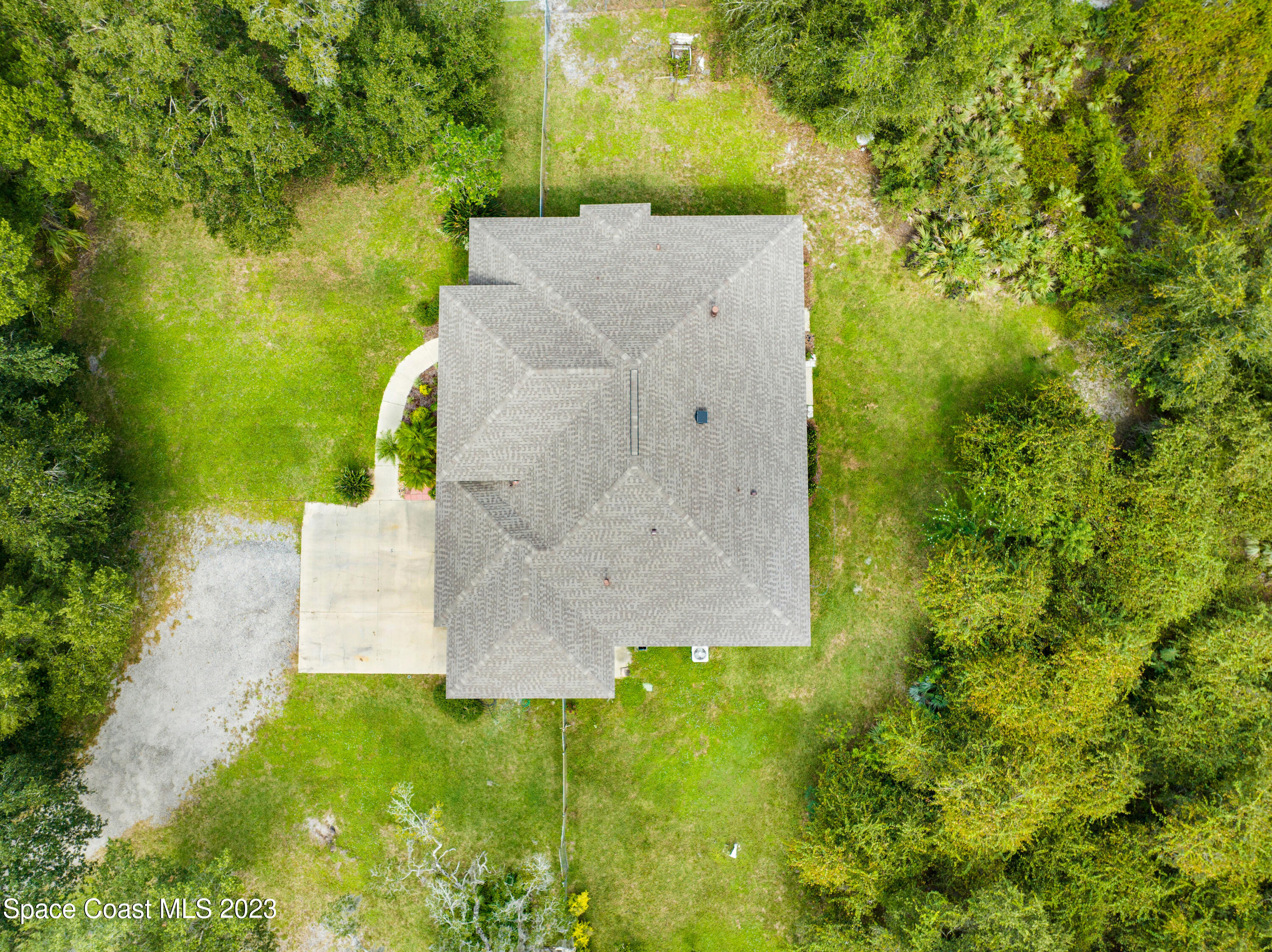 1074 Gray Road Cocoa, FL 32926 - Photo 44 of 47 an aerial view of a house with a yard