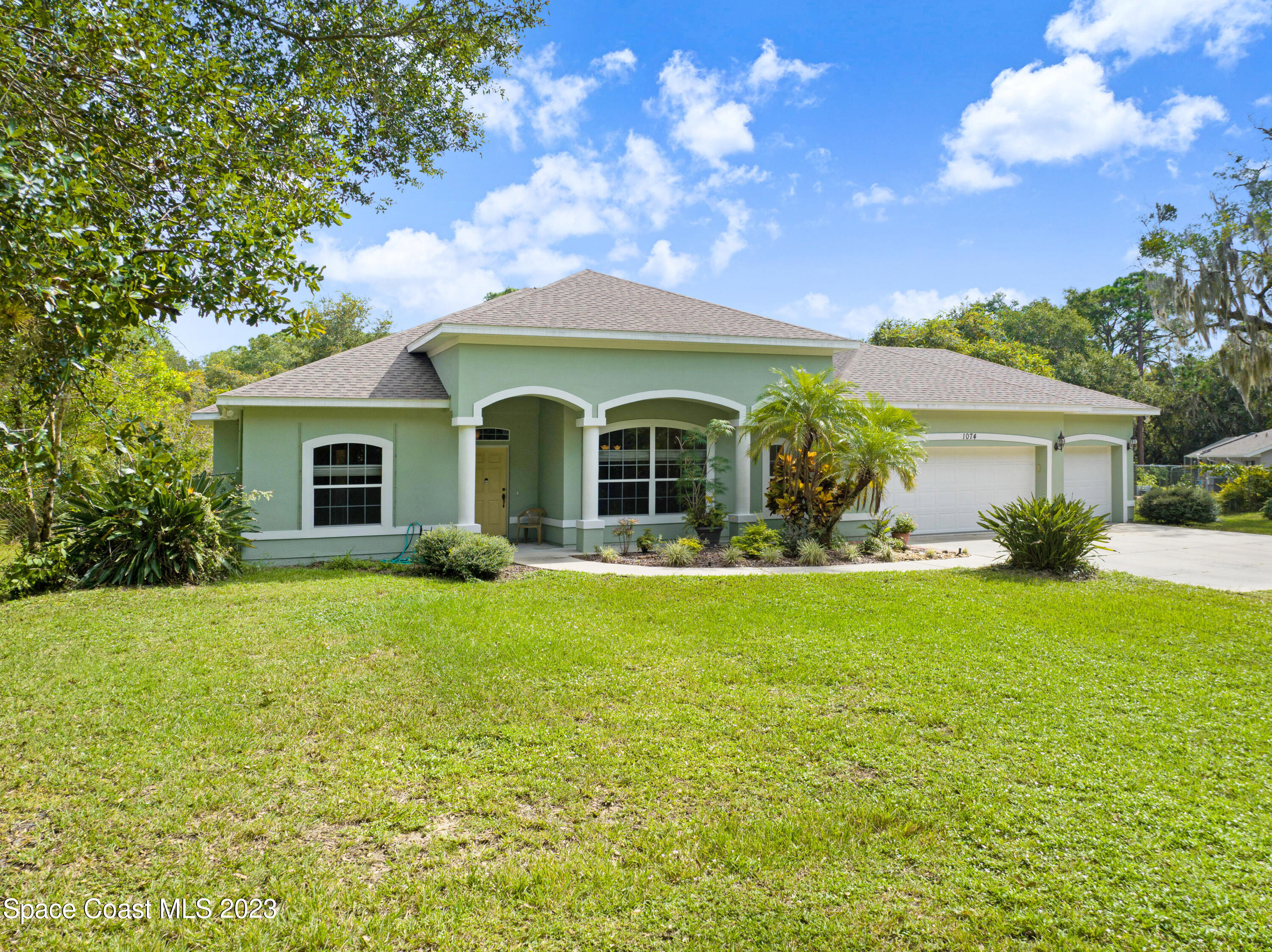 1074 Gray Road Cocoa, FL 32926 - Photo 46 of 47 a front view of a house with garden