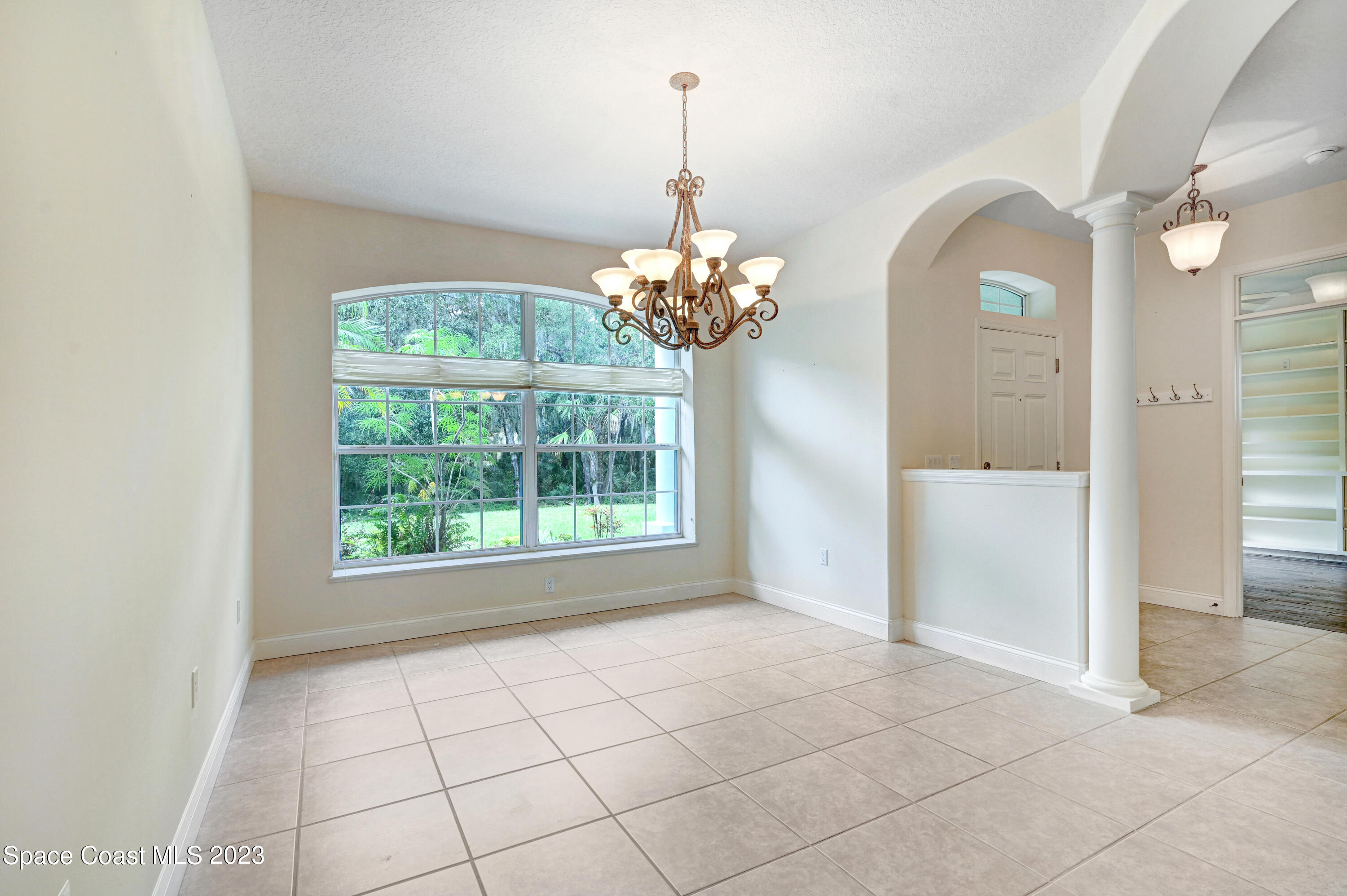 1074 Gray Road Cocoa, FL 32926 - Photo 8 of 47 a view of an empty room with a window