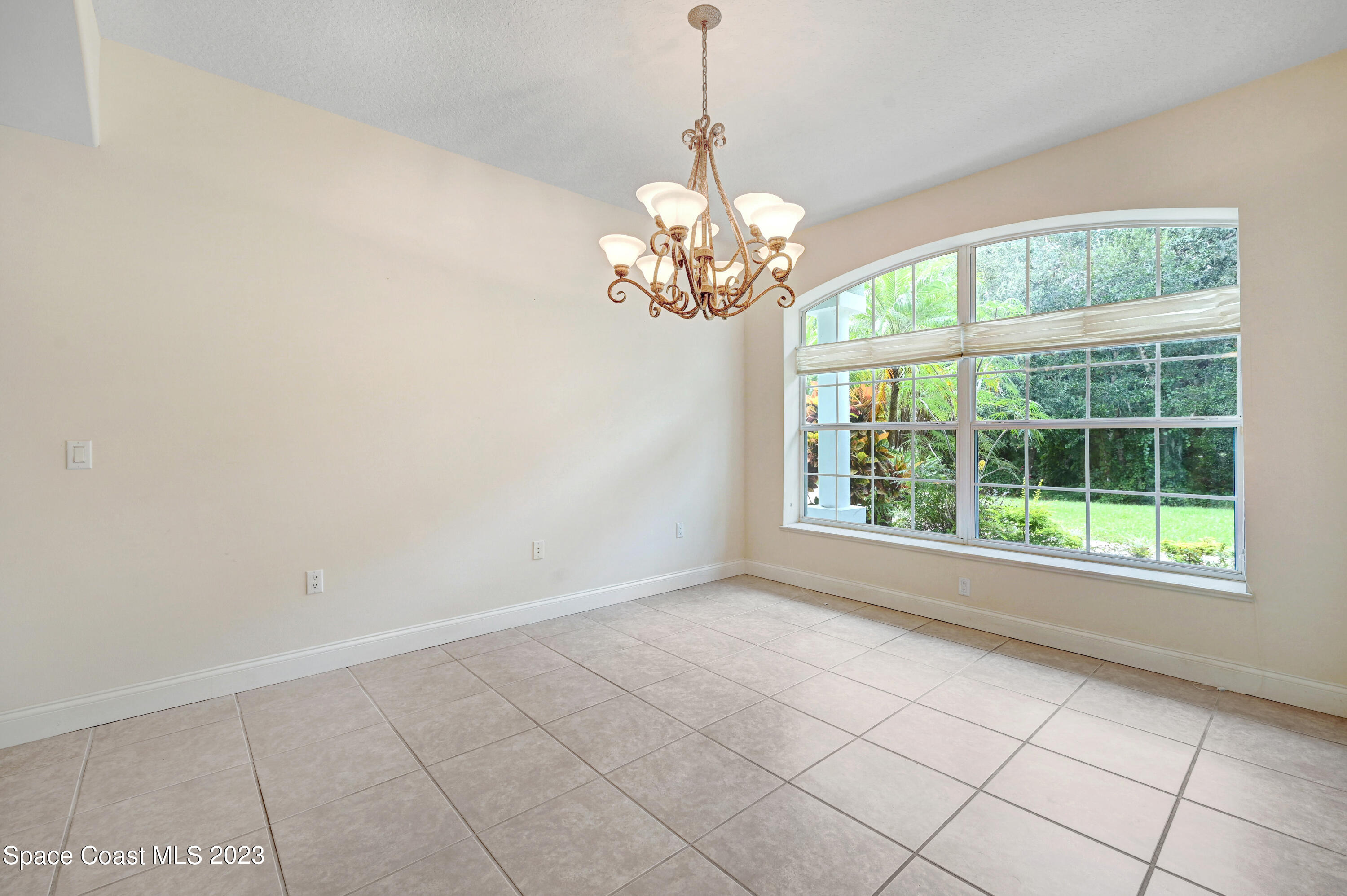 1074 Gray Road Cocoa, FL 32926 - Photo 10 of 47 a view of an empty room with a window