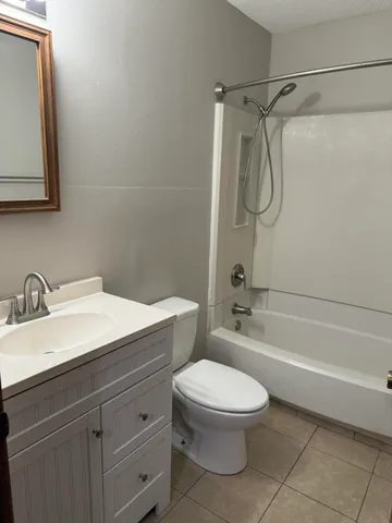 a bathroom with a sink a toilet and a bathtub