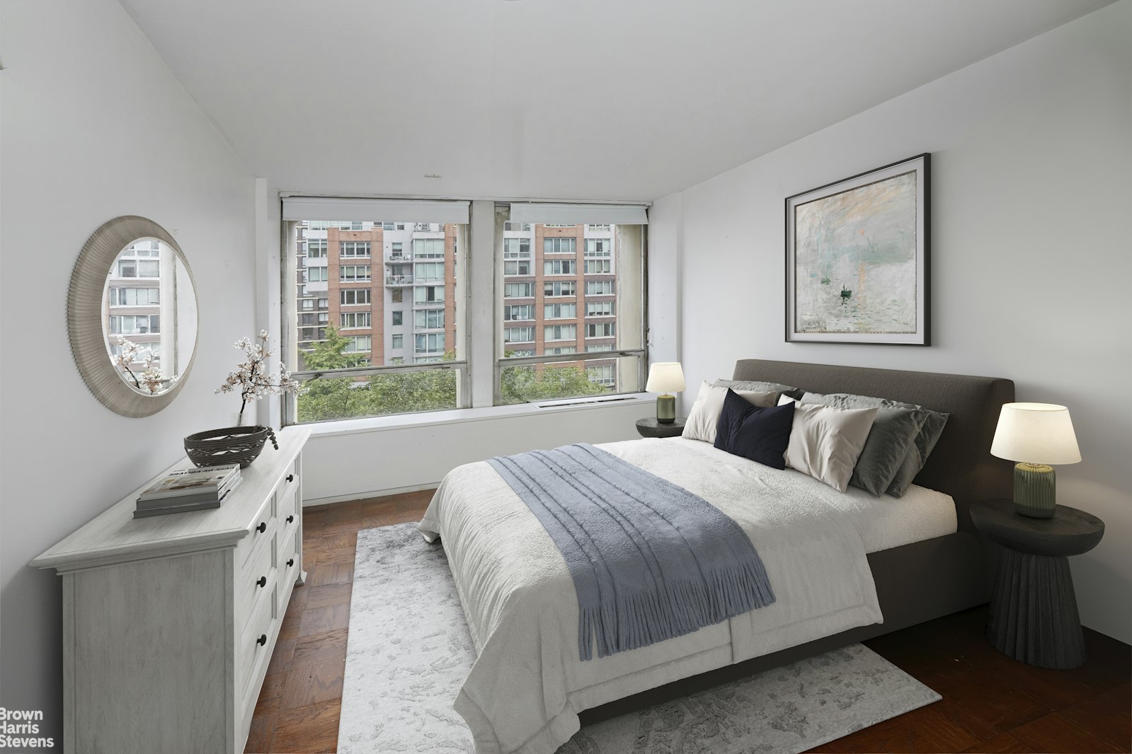 300 East 33rd Street, Unit 2KL Manhattan, NY 10016 - Photo 5 of 11 a bedroom with a bed a mirror and a large window