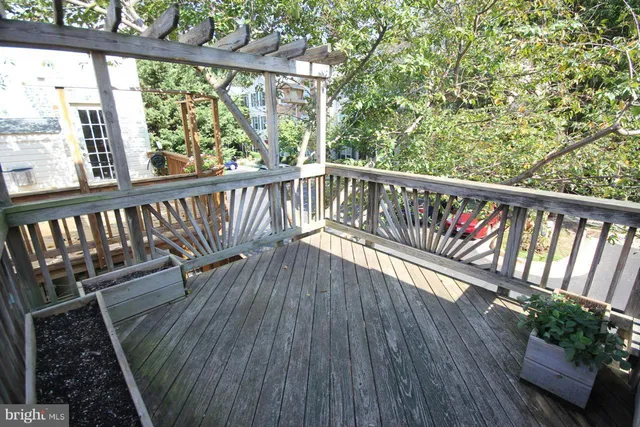 a view of balcony with wooden floor