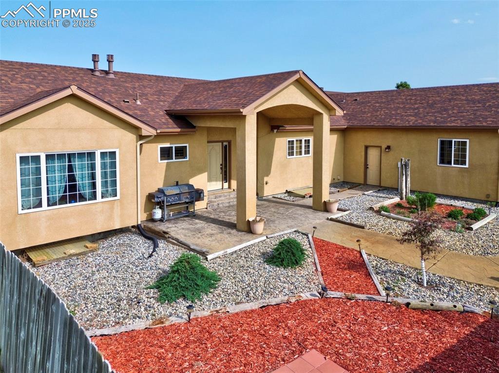 1625 North Yoder Road Yoder, CO 80864 - Photo 1 of 50 a front view of a house with garden