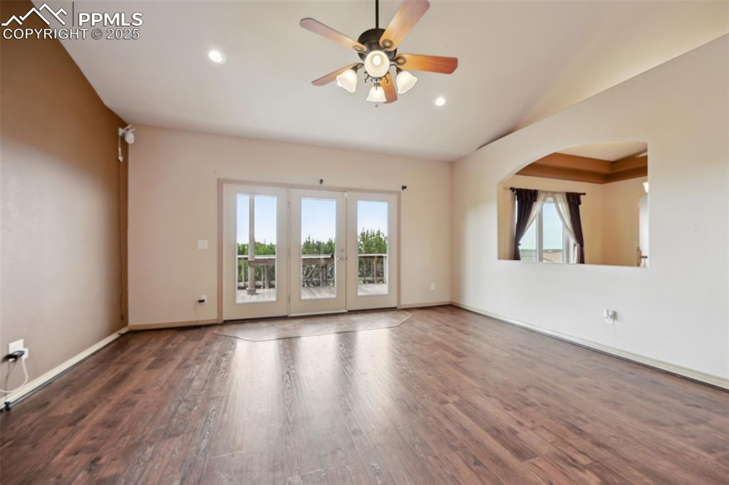 1625 North Yoder Road Yoder, CO 80864 - Photo 12 of 50 a view of an empty room with a window and wooden floor