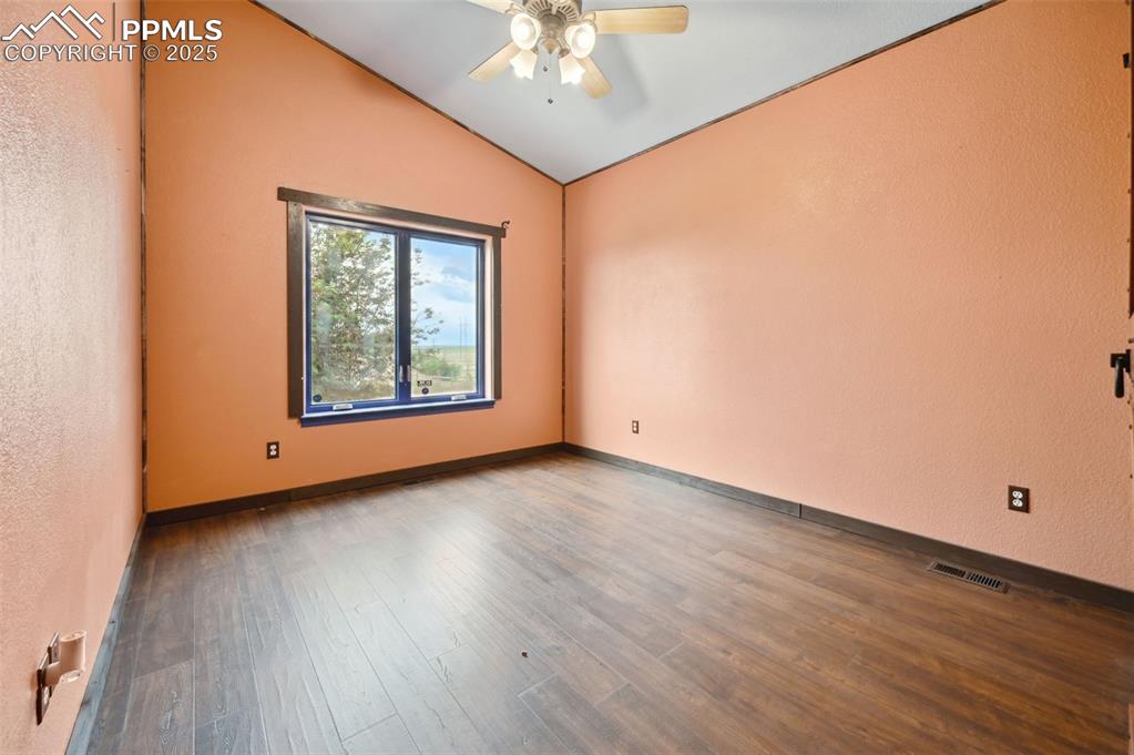 1625 North Yoder Road Yoder, CO 80864 - Photo 25 of 50 a view of a room with wooden floor and chandelier