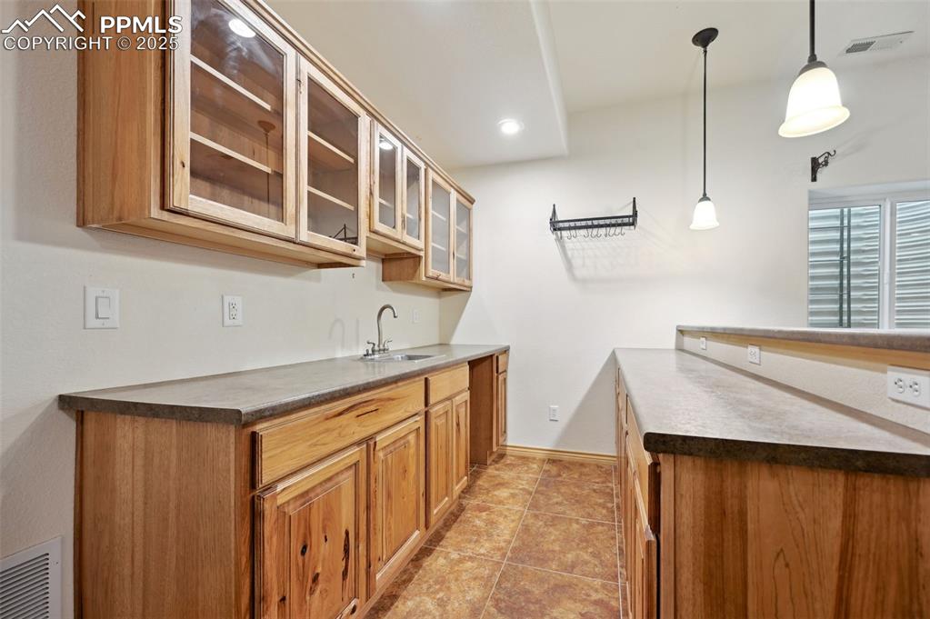 1625 North Yoder Road Yoder, CO 80864 - Photo 29 of 50 a kitchen with a sink stove and cabinets