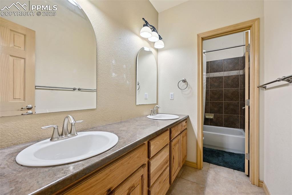 1625 North Yoder Road Yoder, CO 80864 - Photo 33 of 50 a bathroom with a granite countertop sink and a mirror