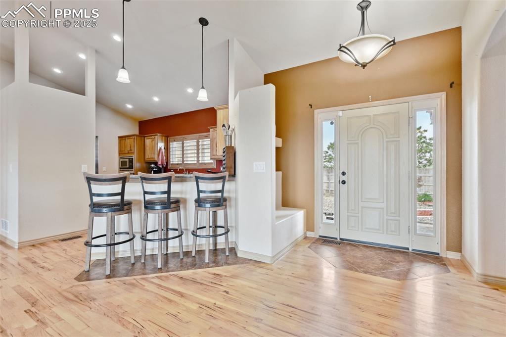 1625 North Yoder Road Yoder, CO 80864 - Photo 4 of 50 a view of a kitchen with furniture and wooden floor