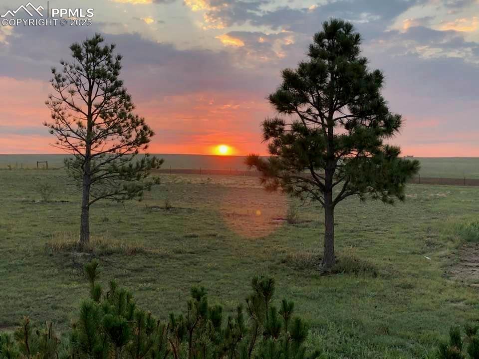 1625 North Yoder Road Yoder, CO 80864 - Photo 49 of 50 a view of a lake with a yard
