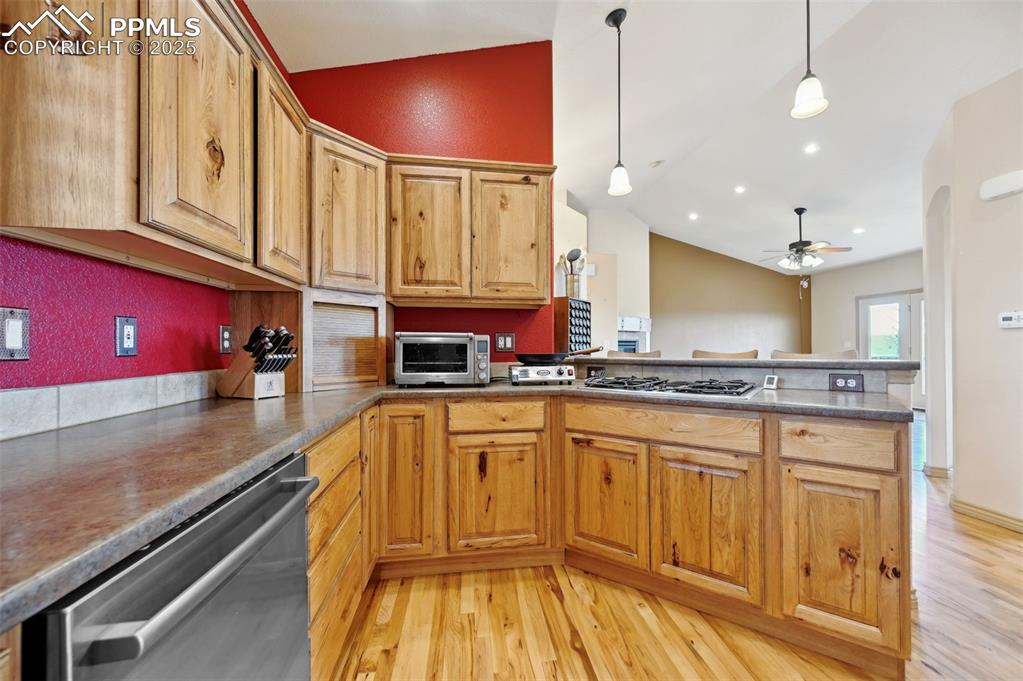1625 North Yoder Road Yoder, CO 80864 - Photo 5 of 50 a kitchen with stainless steel appliances granite countertop a sink and cabinets