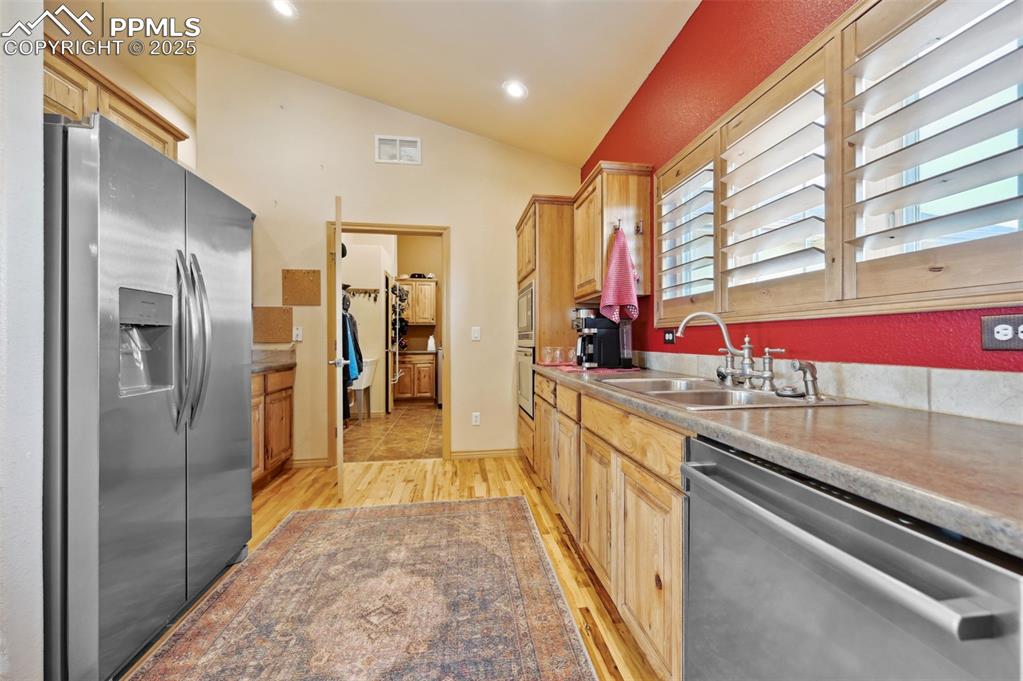 1625 North Yoder Road Yoder, CO 80864 - Photo 8 of 50 a kitchen with stainless steel appliances granite countertop a refrigerator and a sink