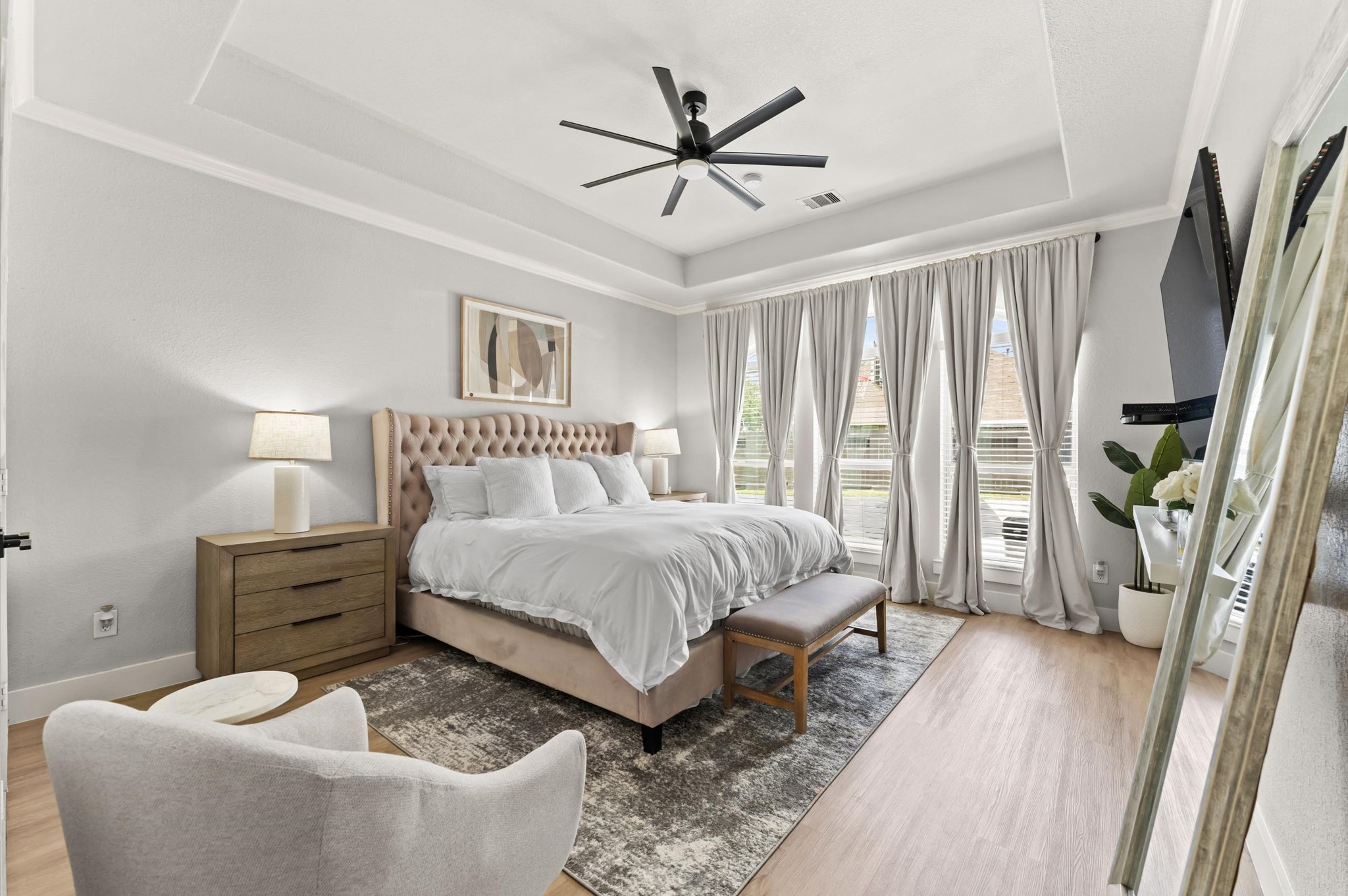 14016 Savannah Landing Lane Rosharon, TX 77583 - Photo 21 of 49 a spacious bedroom with a bed and a chandelier